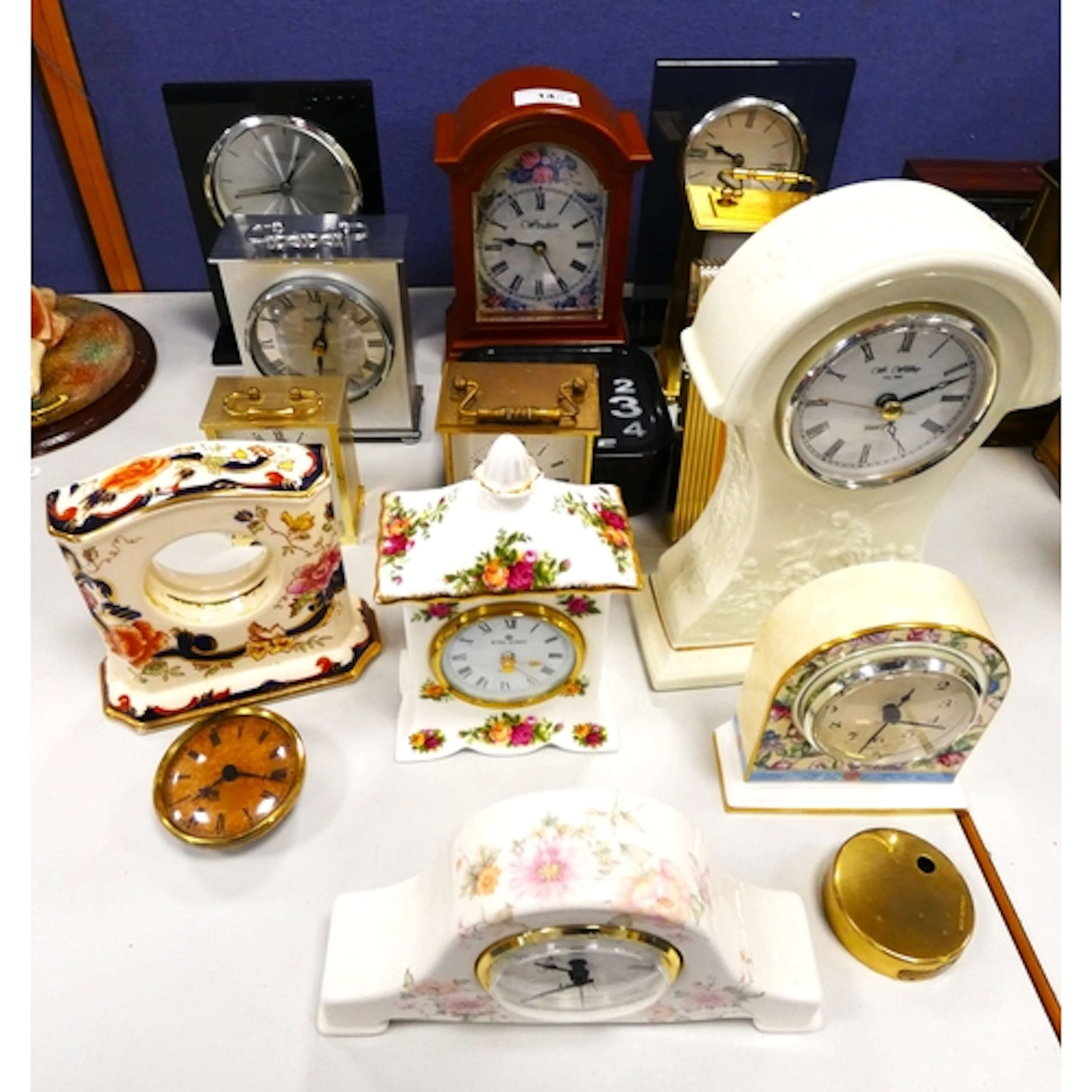 Large collection of ceramic and other mantel clocks to inclu...