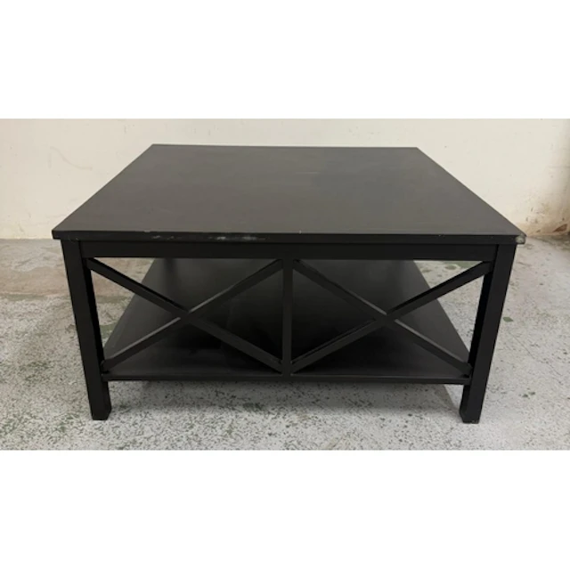 A contemporary square black coffee table with shelf under...