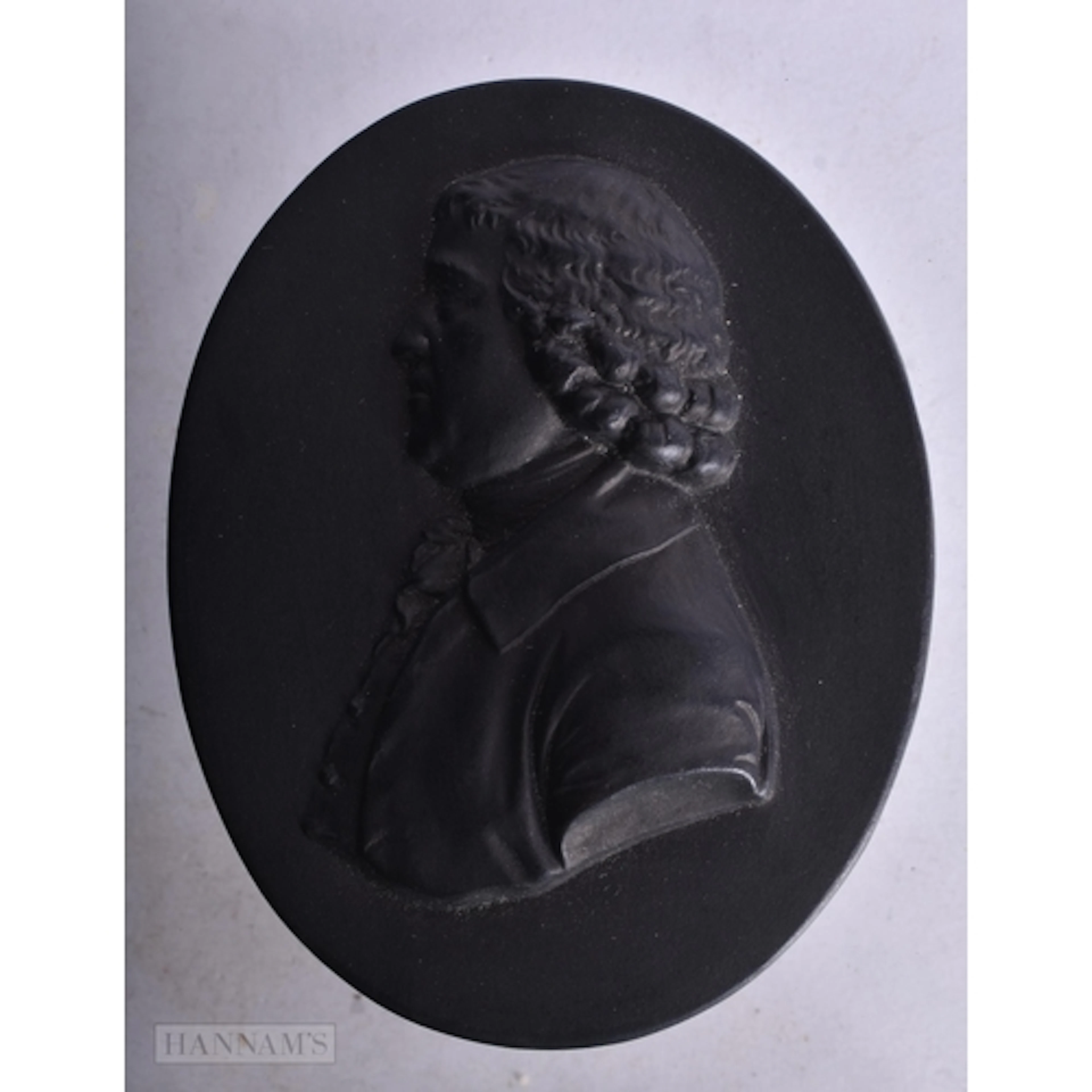 AN ANTIQUE BLACK JASPERWARE PORTRAIT MEDALLION. 8.75 cm x 7 ...