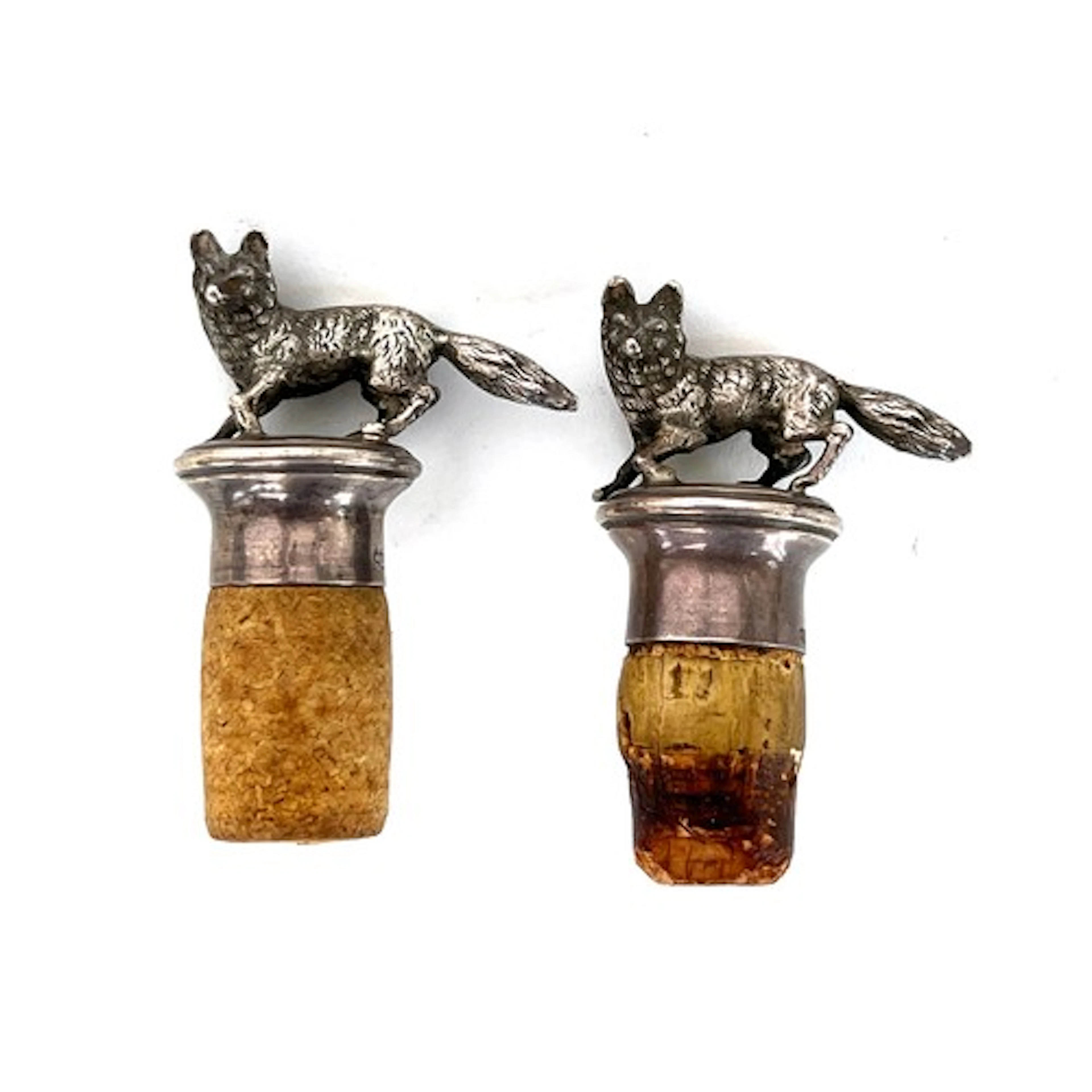 A pair of .925 silver stoppers in the form of standing foxes...