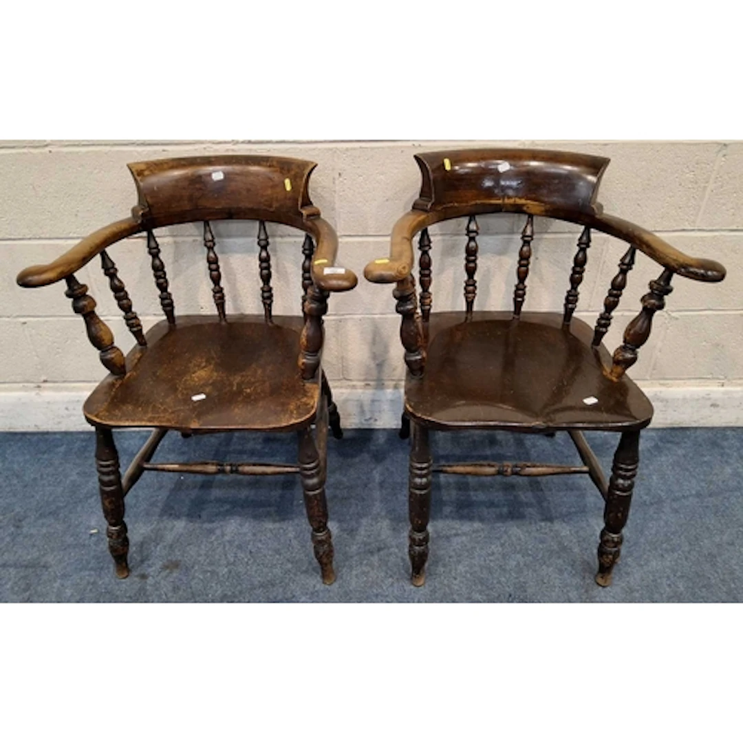 A PAIR OF EARLY 20TH CENTURY STAINED ELM BOW TOP CAPTAINS CH...