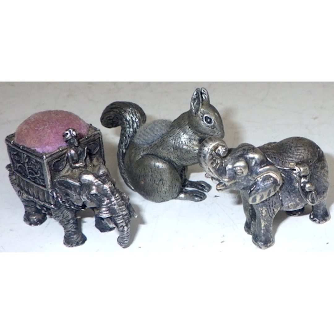 Three novelty pin cushions (3)