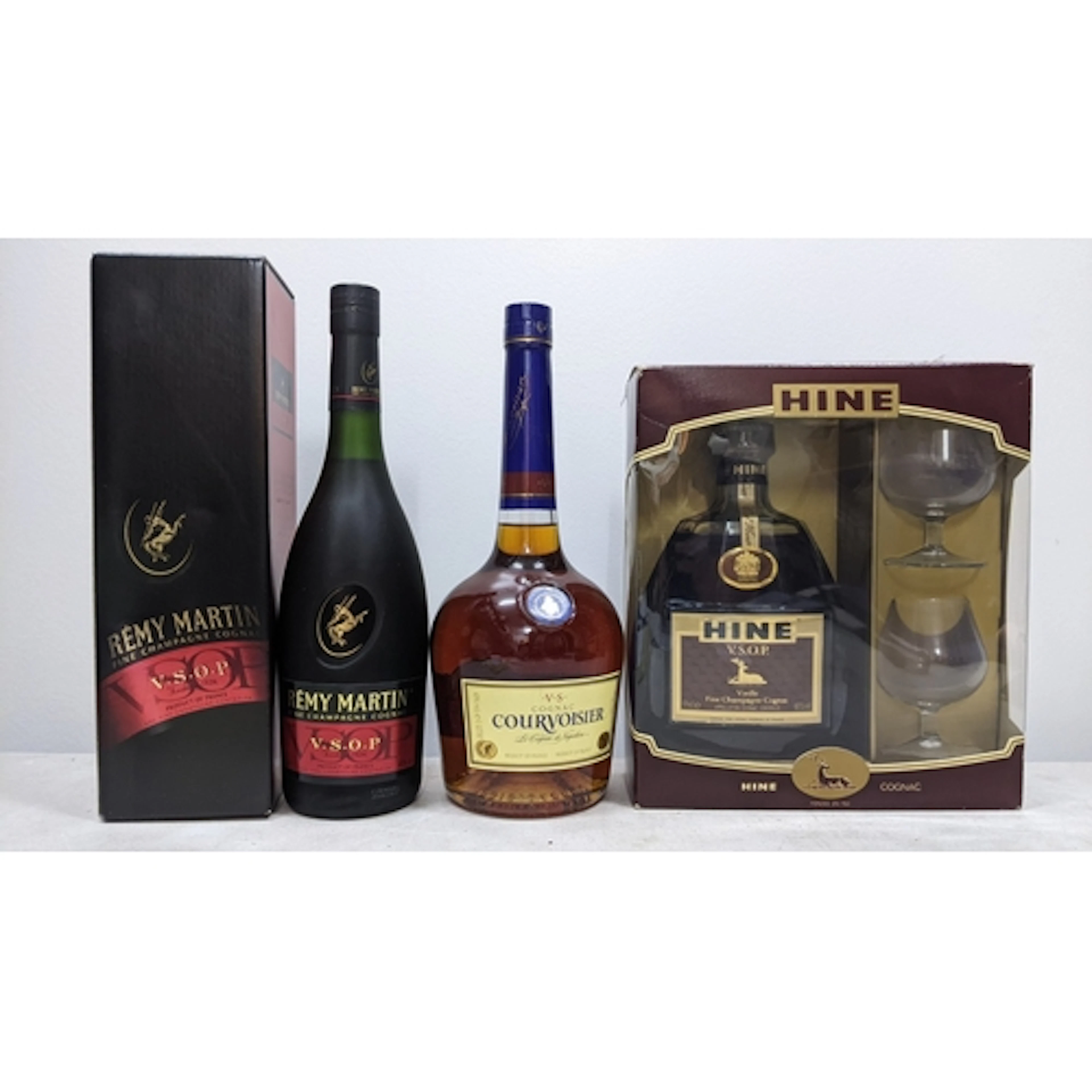 Three bottles of Cognac, comprising: - One bottle Rémy Marti...