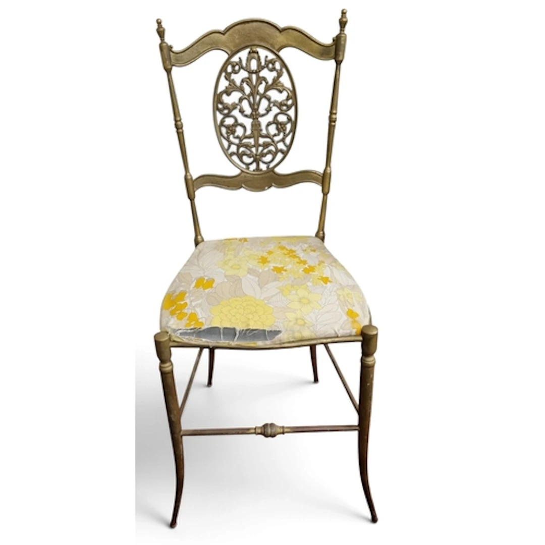 A 20th Century heavy Metal Chair with pierced back outline. ...