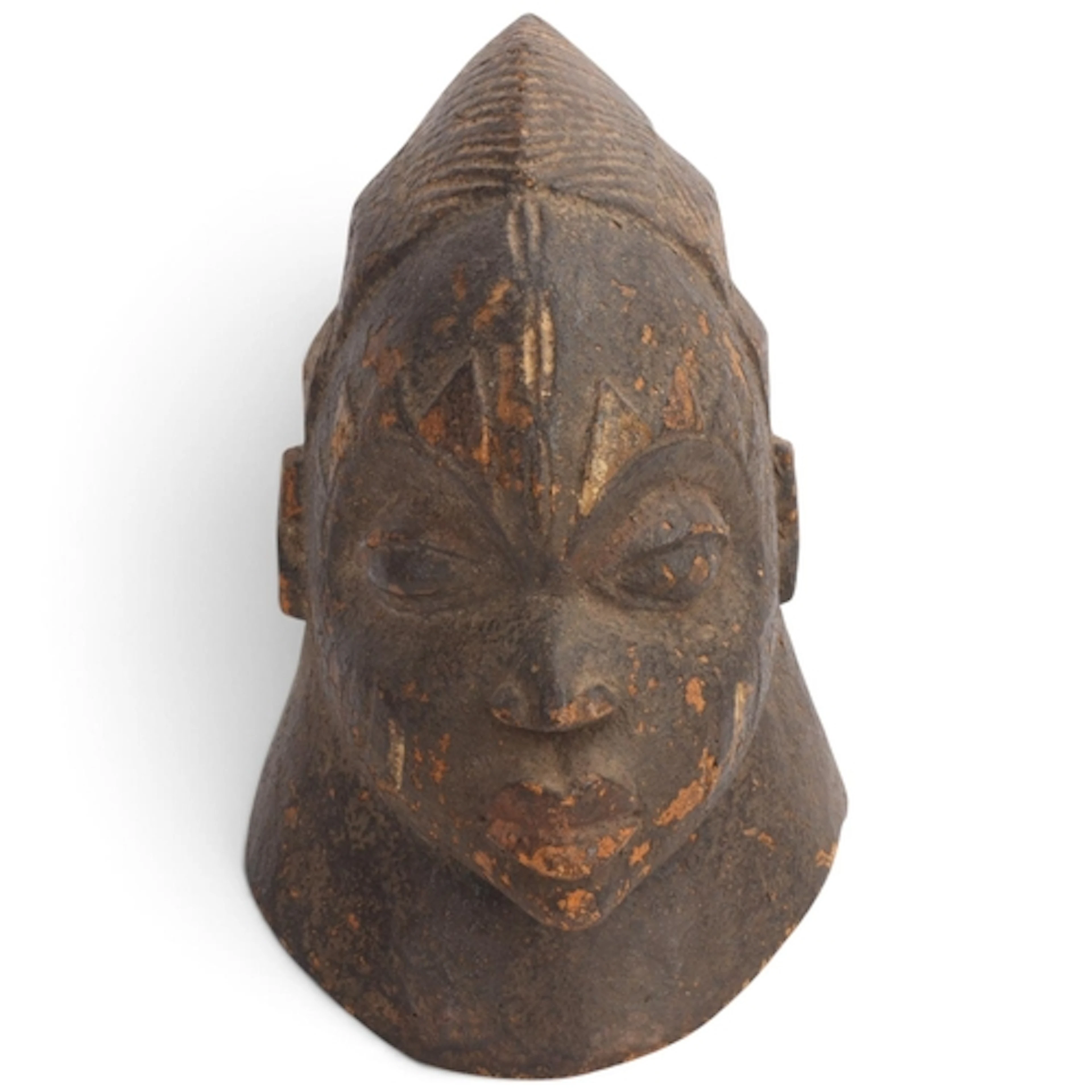A Yoruba helmet mask, West or Central Africa, carved and pai...