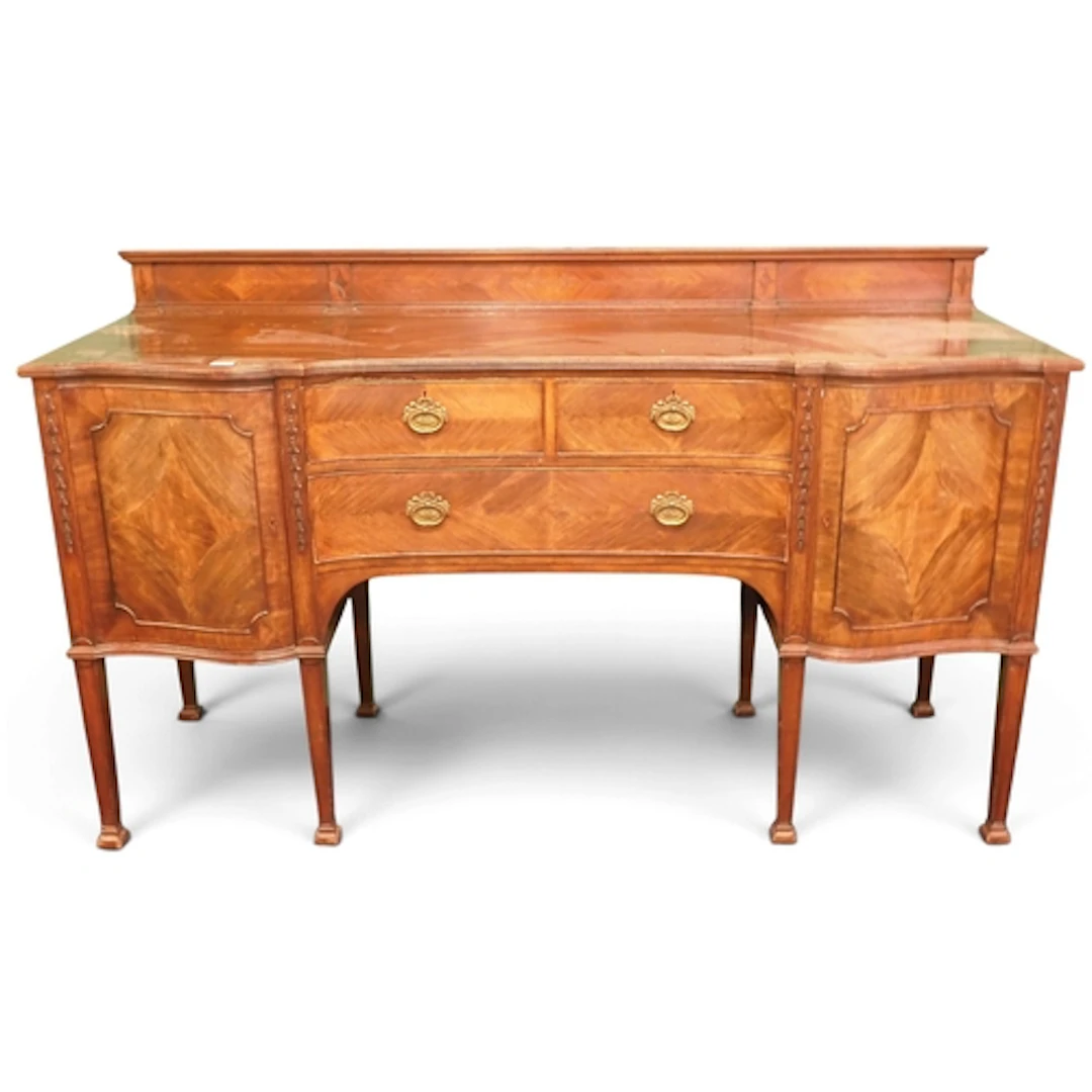 An early 20th century mahogany veneered serpentine front sid...