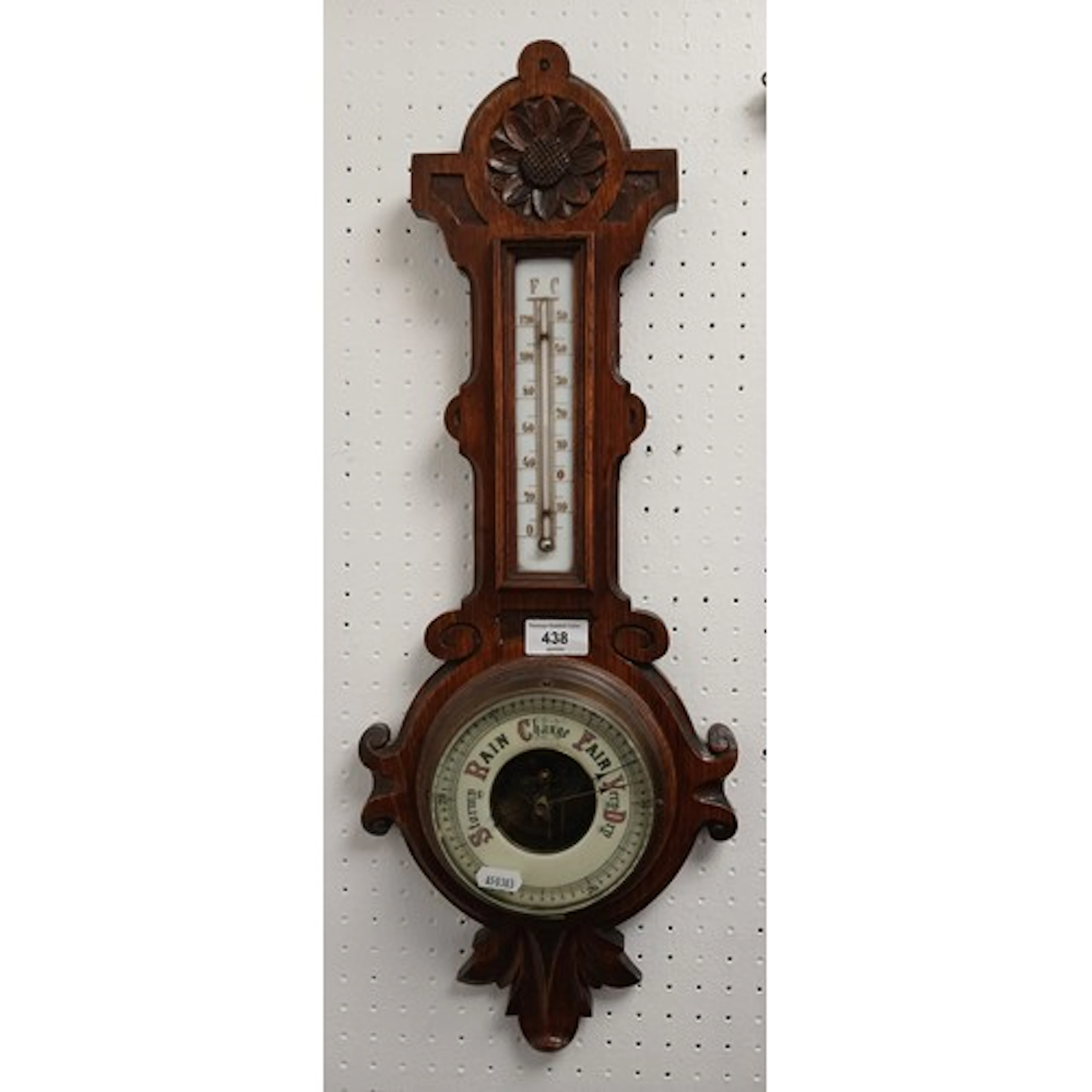 Carved oak barometer.