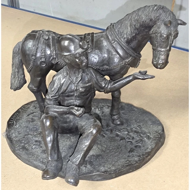 A limited edition sculpture of a miner made from Welsh coal ...