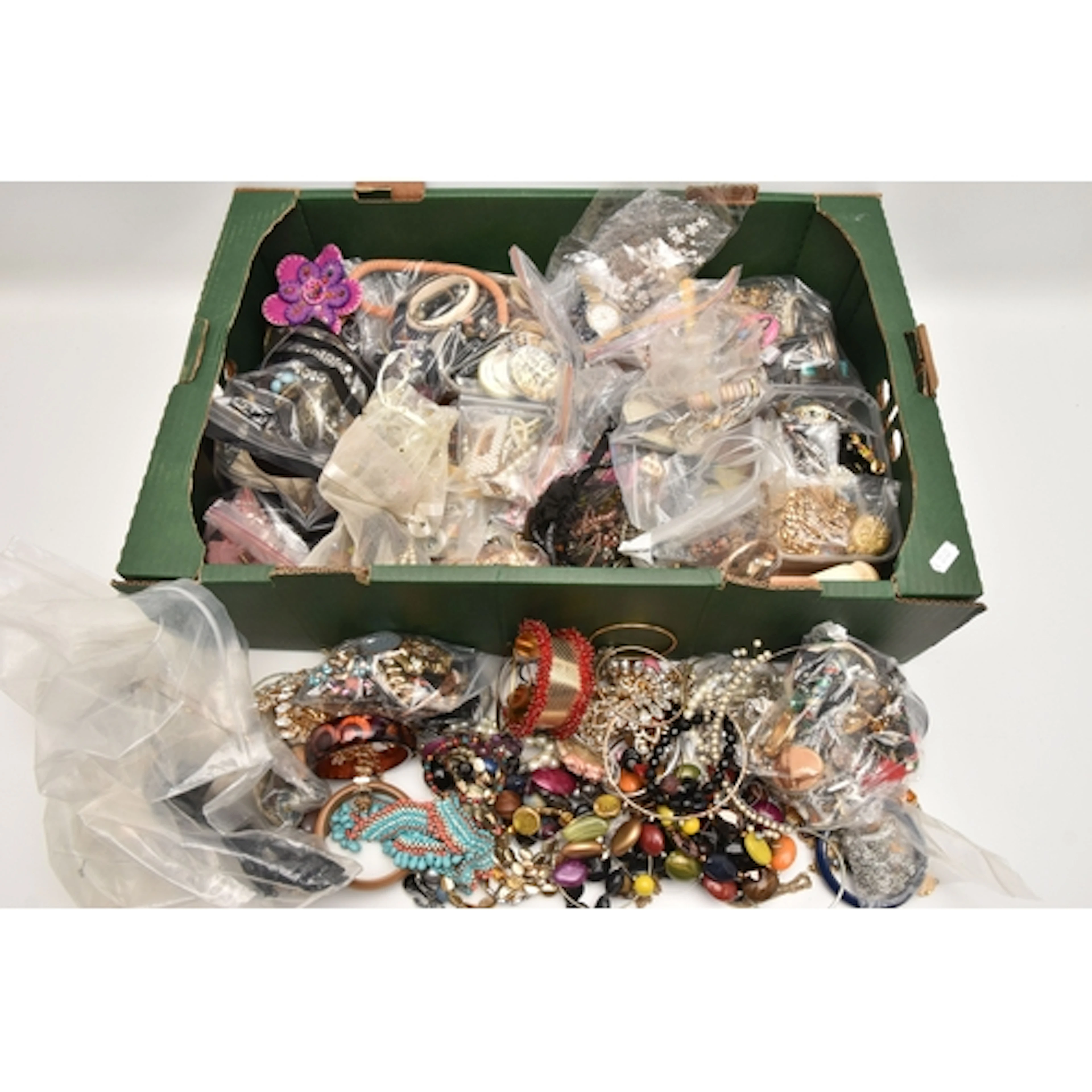 A BOX OF ASSORTED COSTUME JEWELLERY, to include a gold plate...