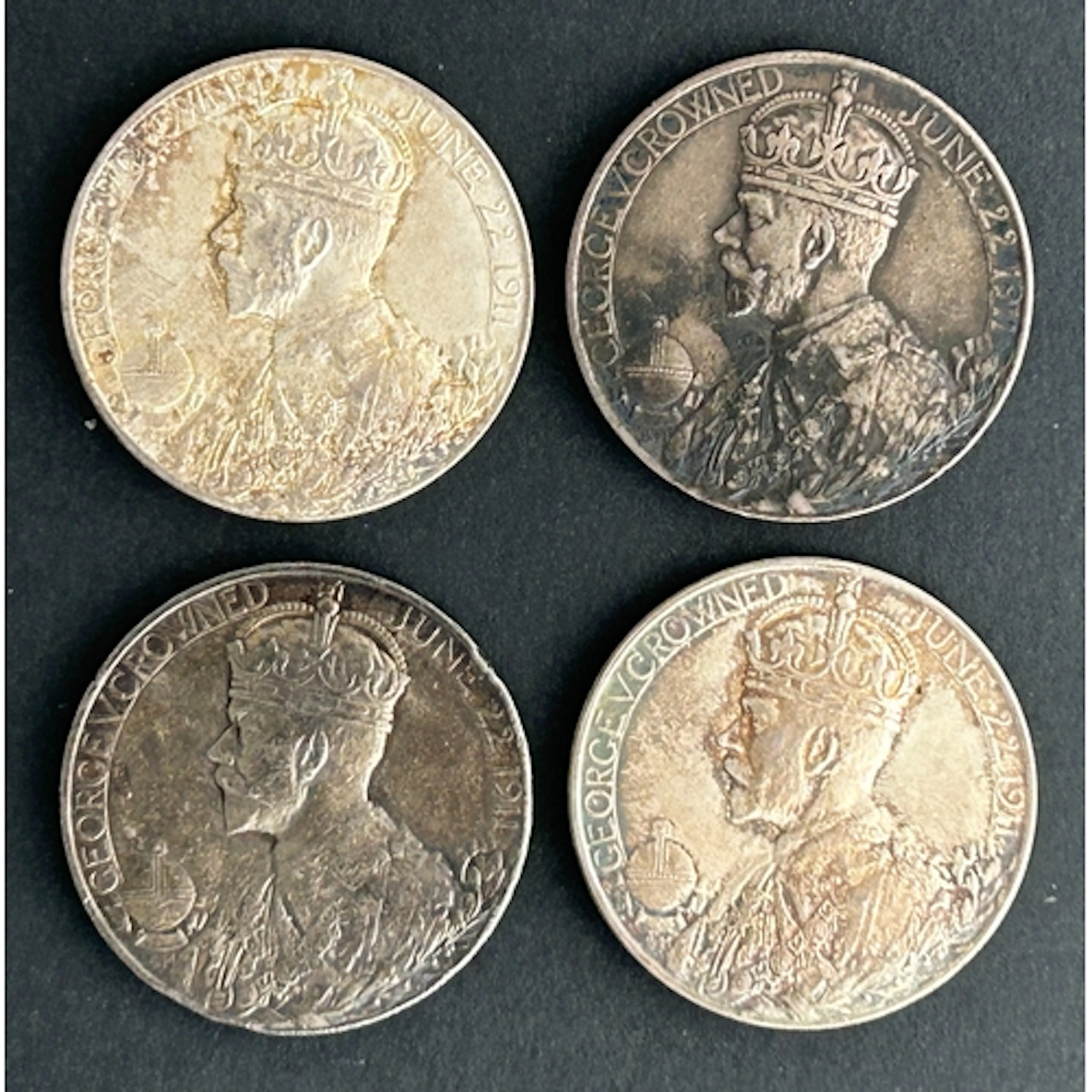 A collection of four official Royal Mint George V, Coronatio...