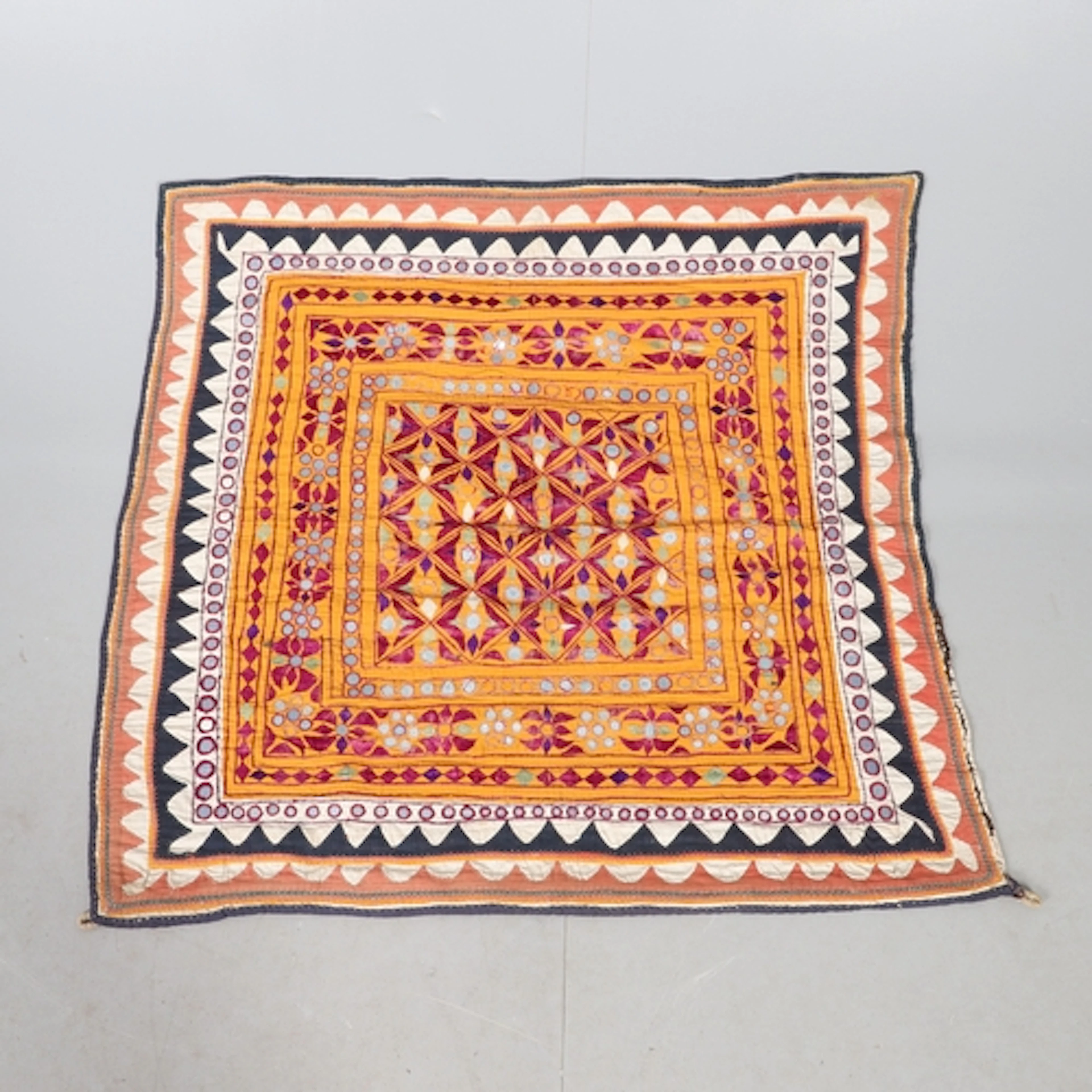 AN INDIAN EMBROIDERED WALL HANGING OR TABLE DECORATION. late...