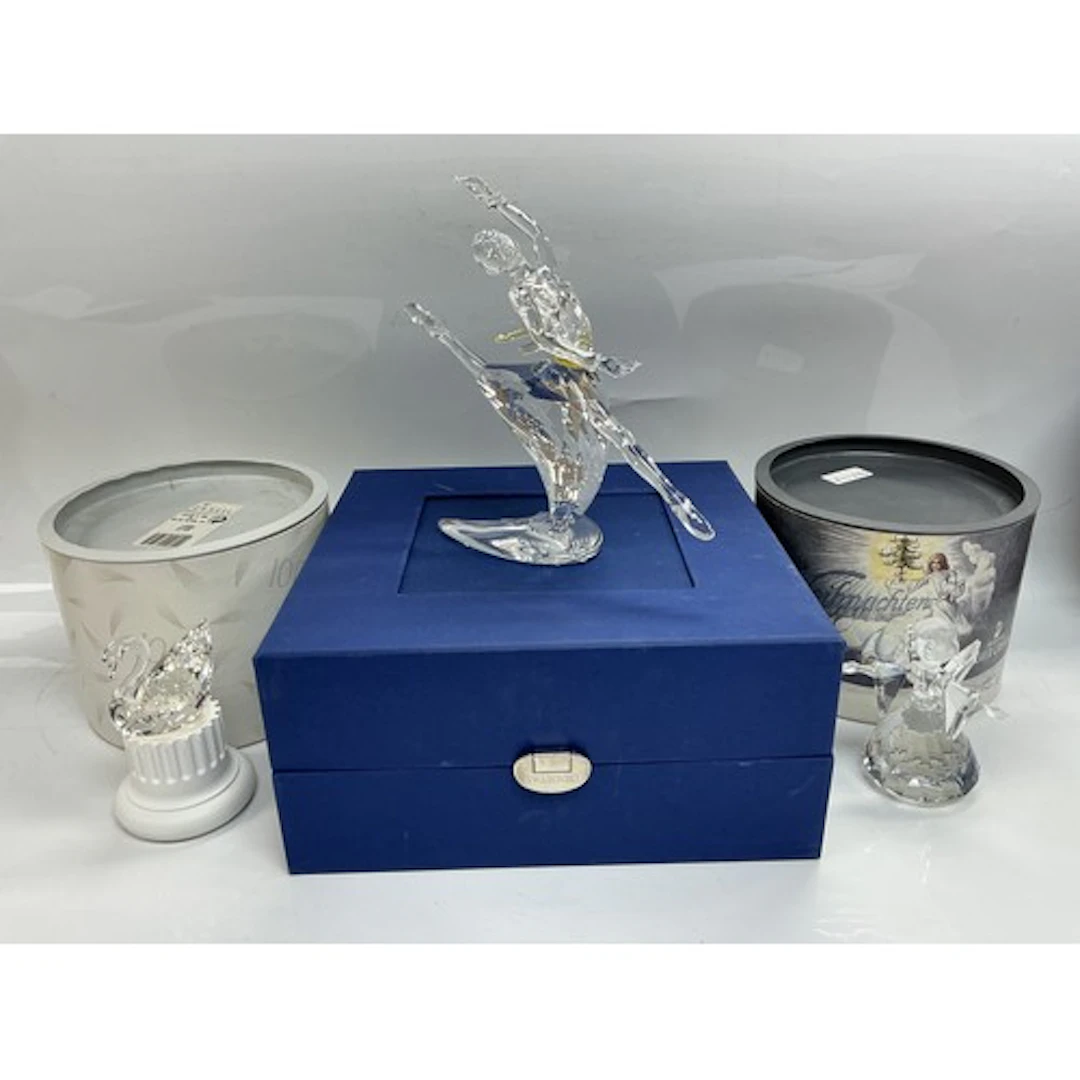 Three boxed Swarovski figures comprising a ballerina, angel ...