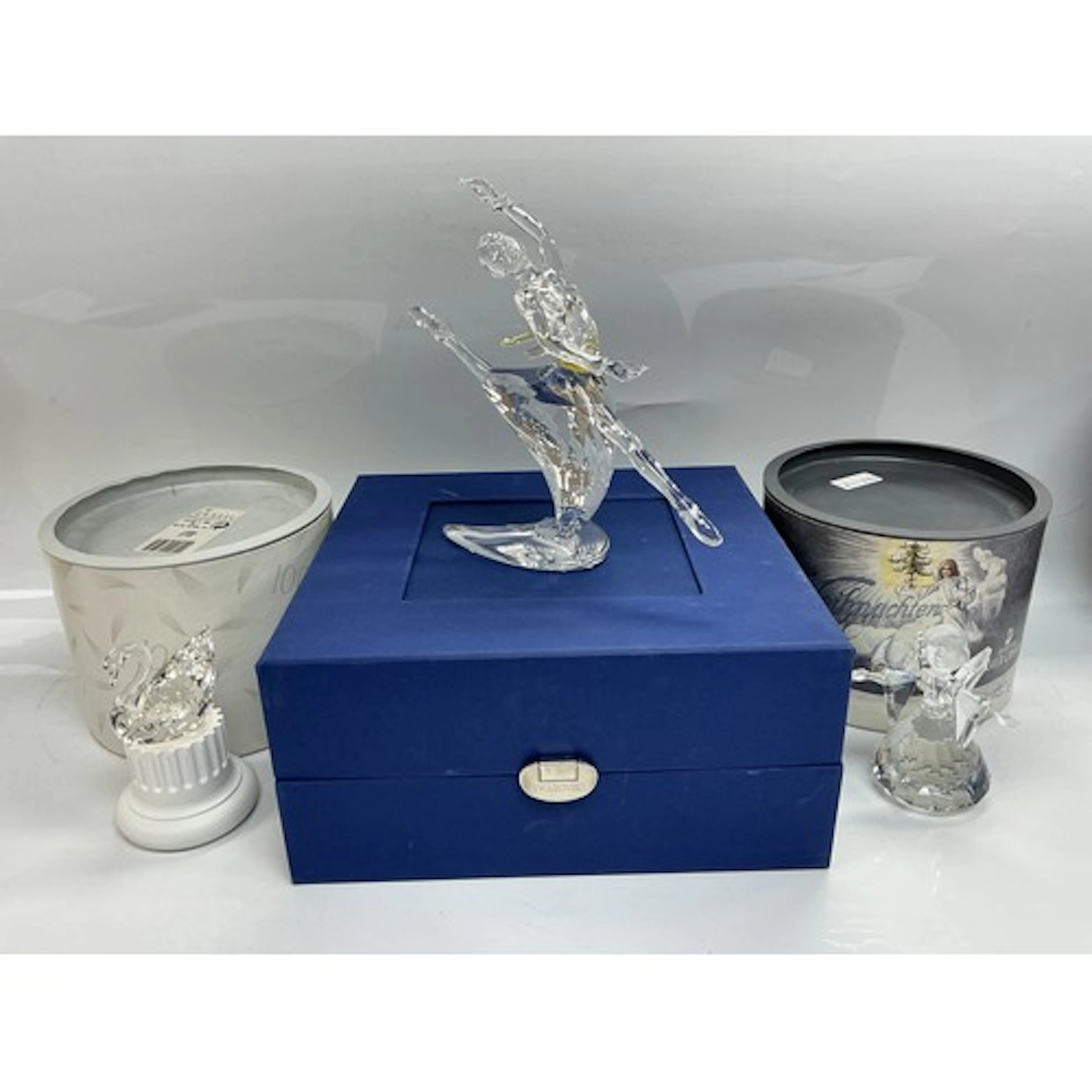 Three boxed Swarovski figures comprising a ballerina, angel ...