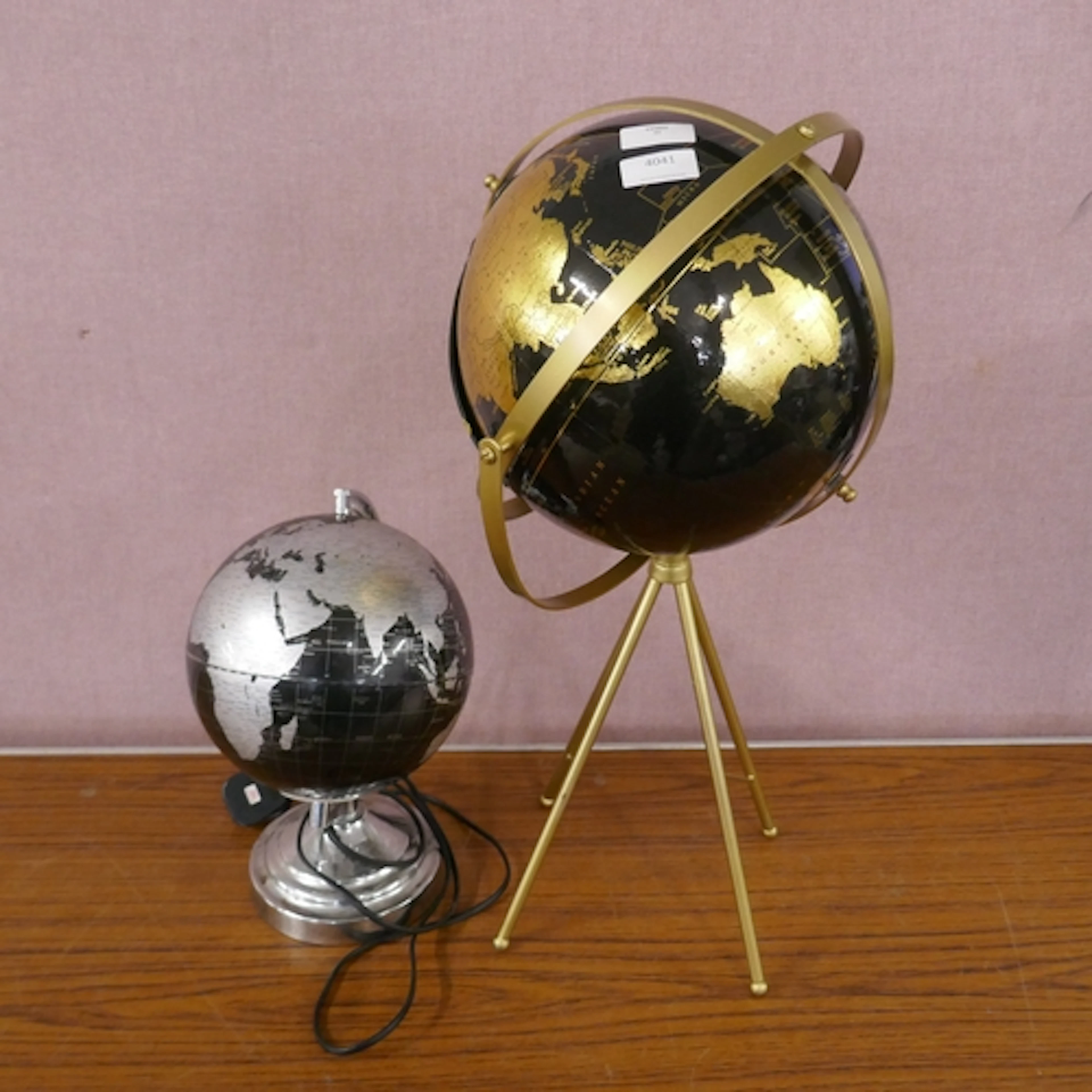 A black/gold decorative globe and a black/silver globe lamp ...