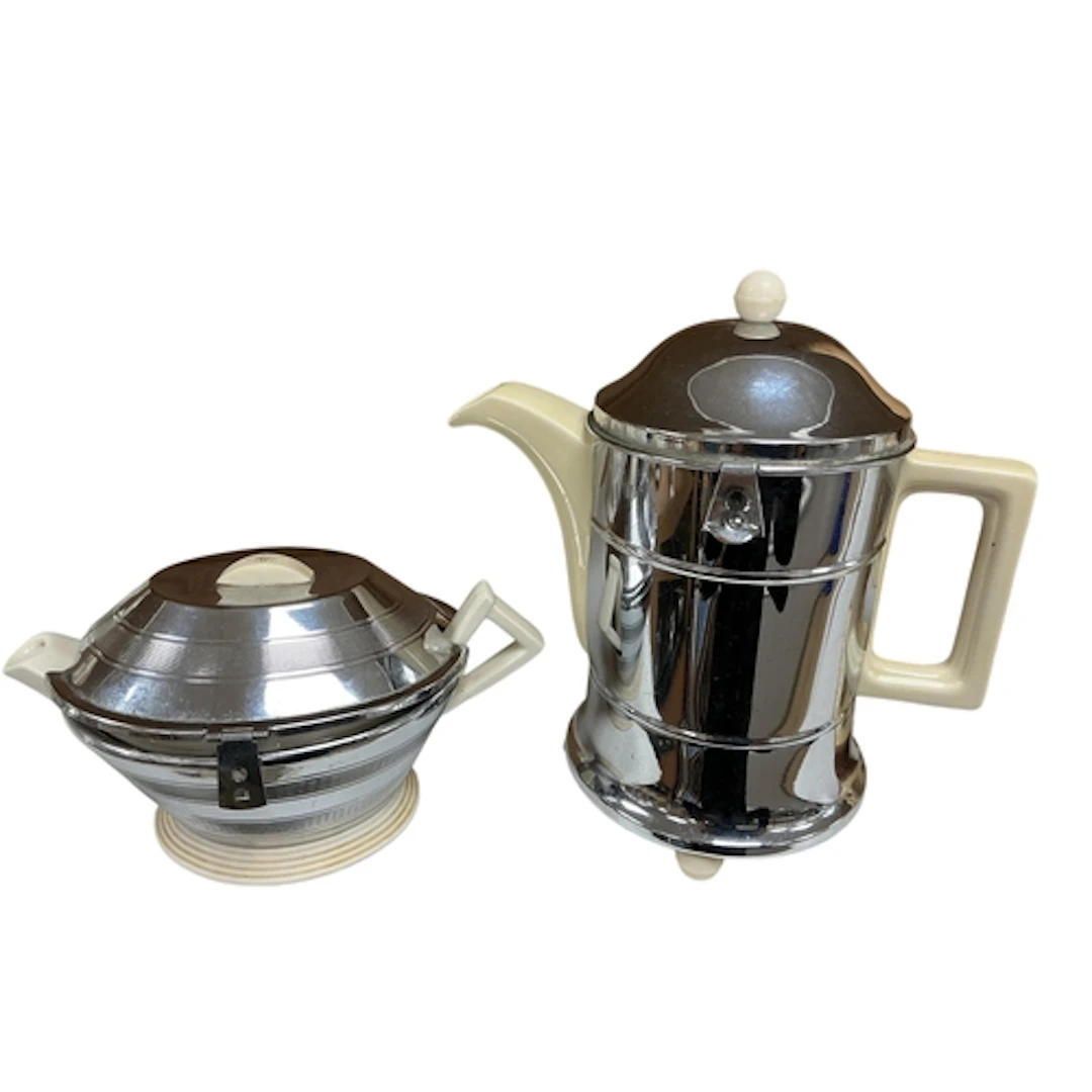 Two mid century pottery and chrome patent insulated teapots,...