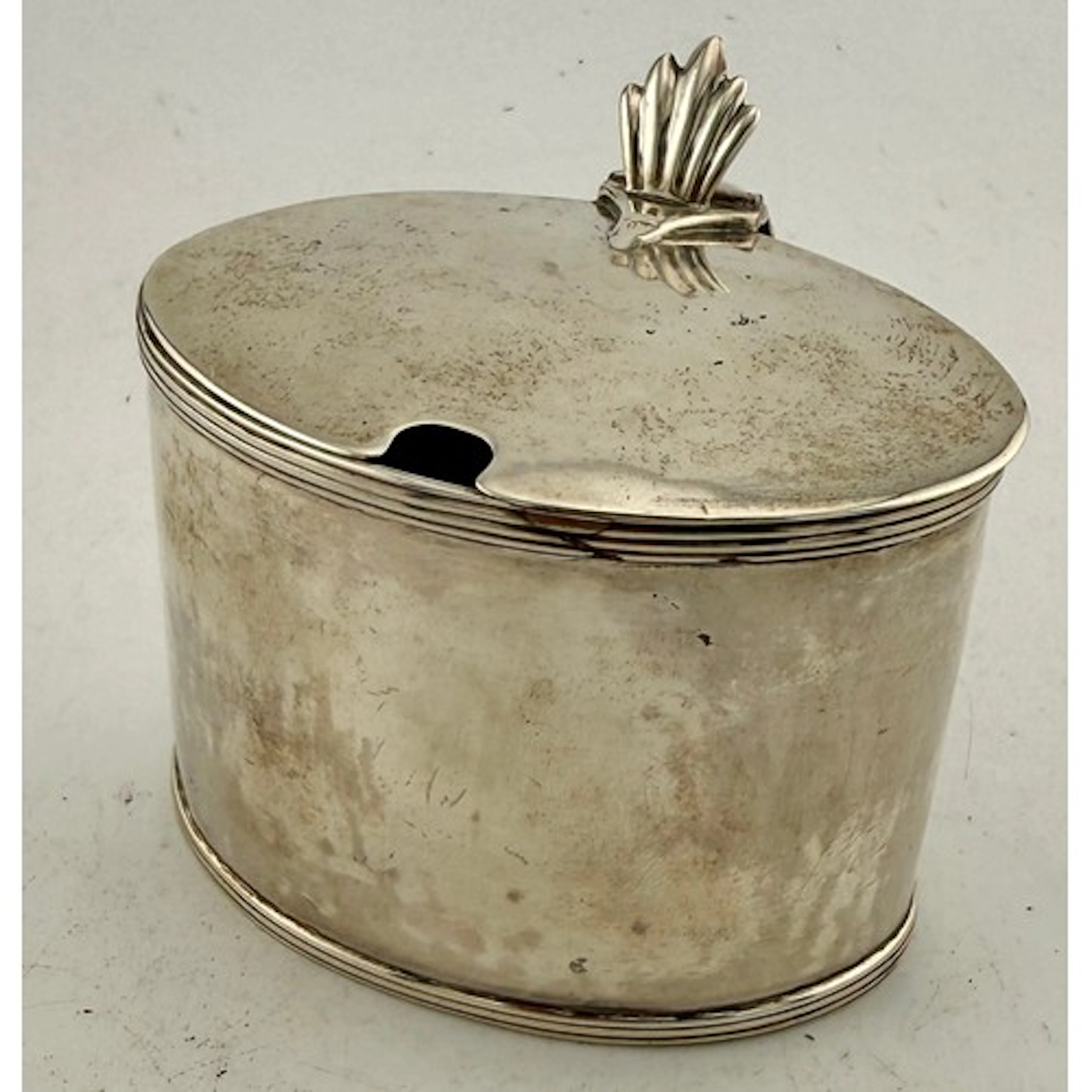 A Georgian hallmarked silver mustard pot with a blue glass l...