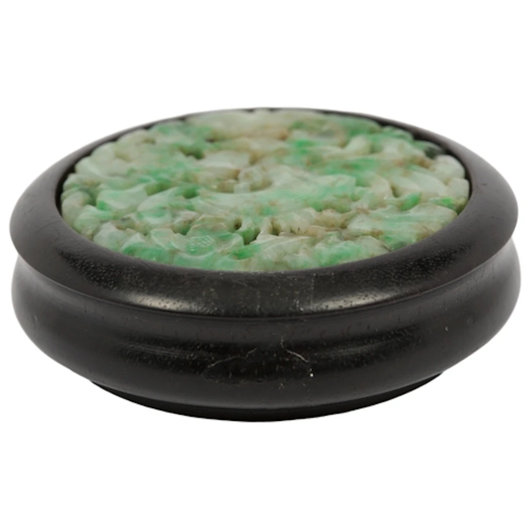A Chinese reticulated jadeite roundel, early 20th century, c...