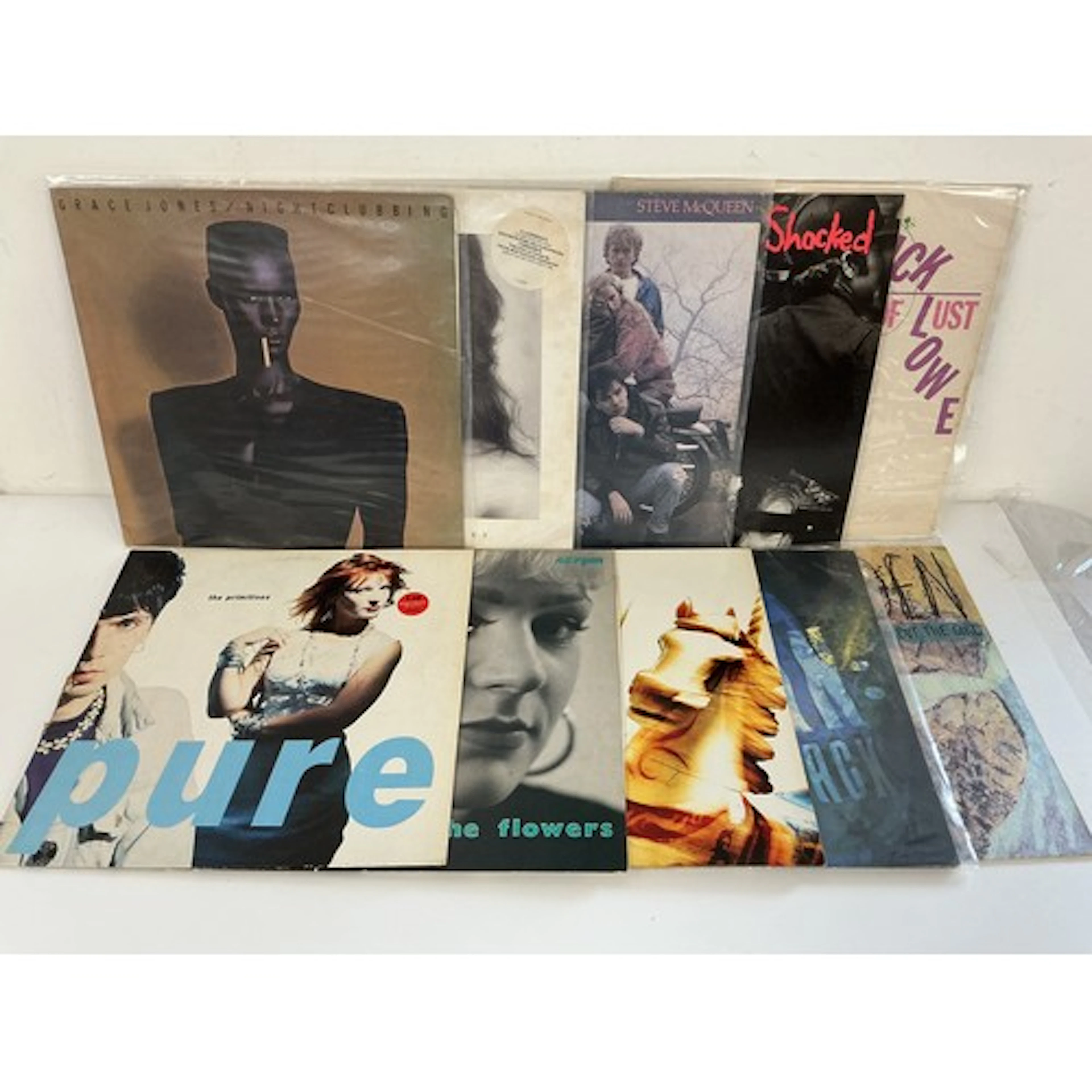 Two bags containing 20 rock and pop LPs and 12” singles by v...