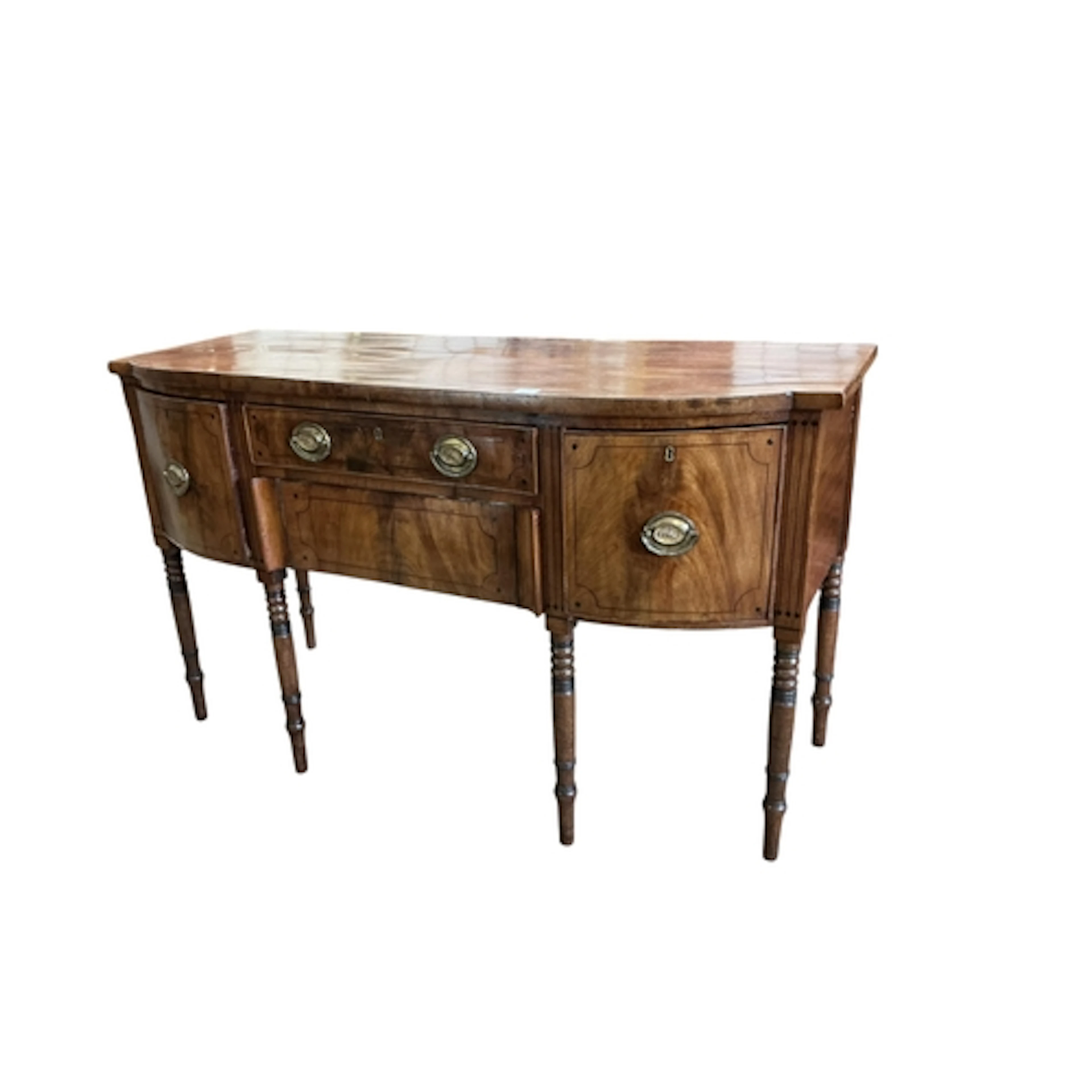 A Regency mahogany and ebony line inlaid bow fronted sideboa...