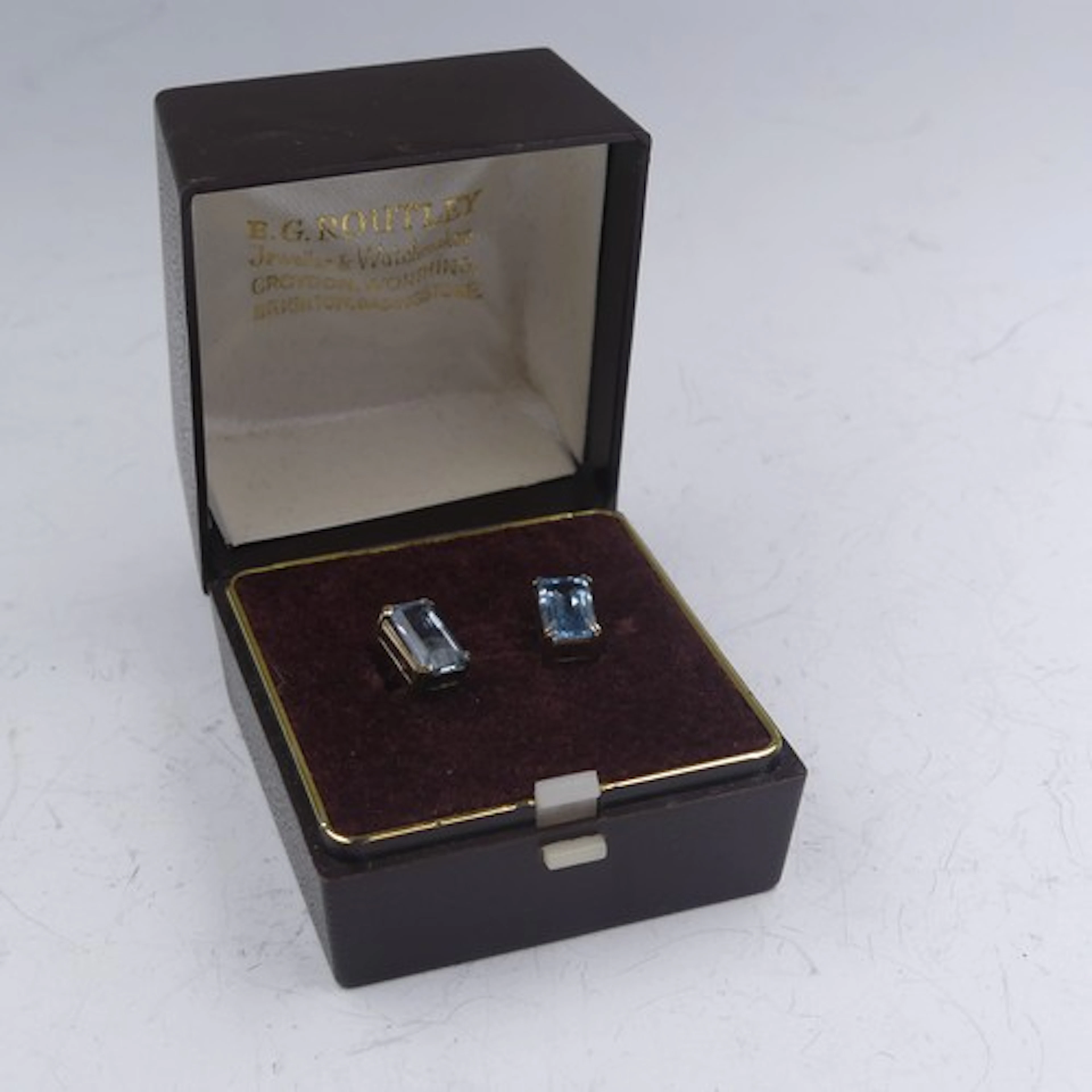 A pair of aquamarine single stone stud Earrings, the step cu...