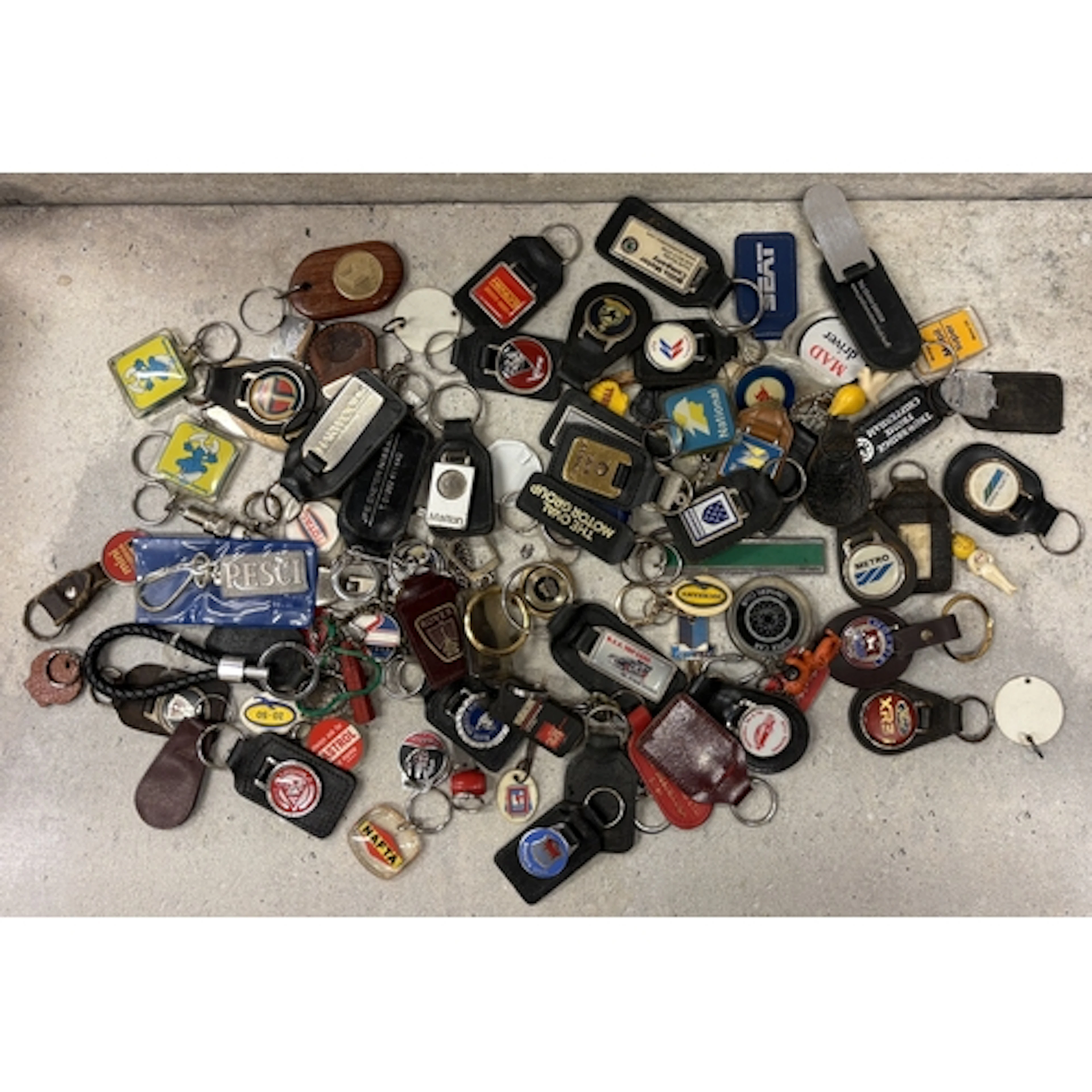 A collection of motoring related keyrings. Est. £20 - £30.