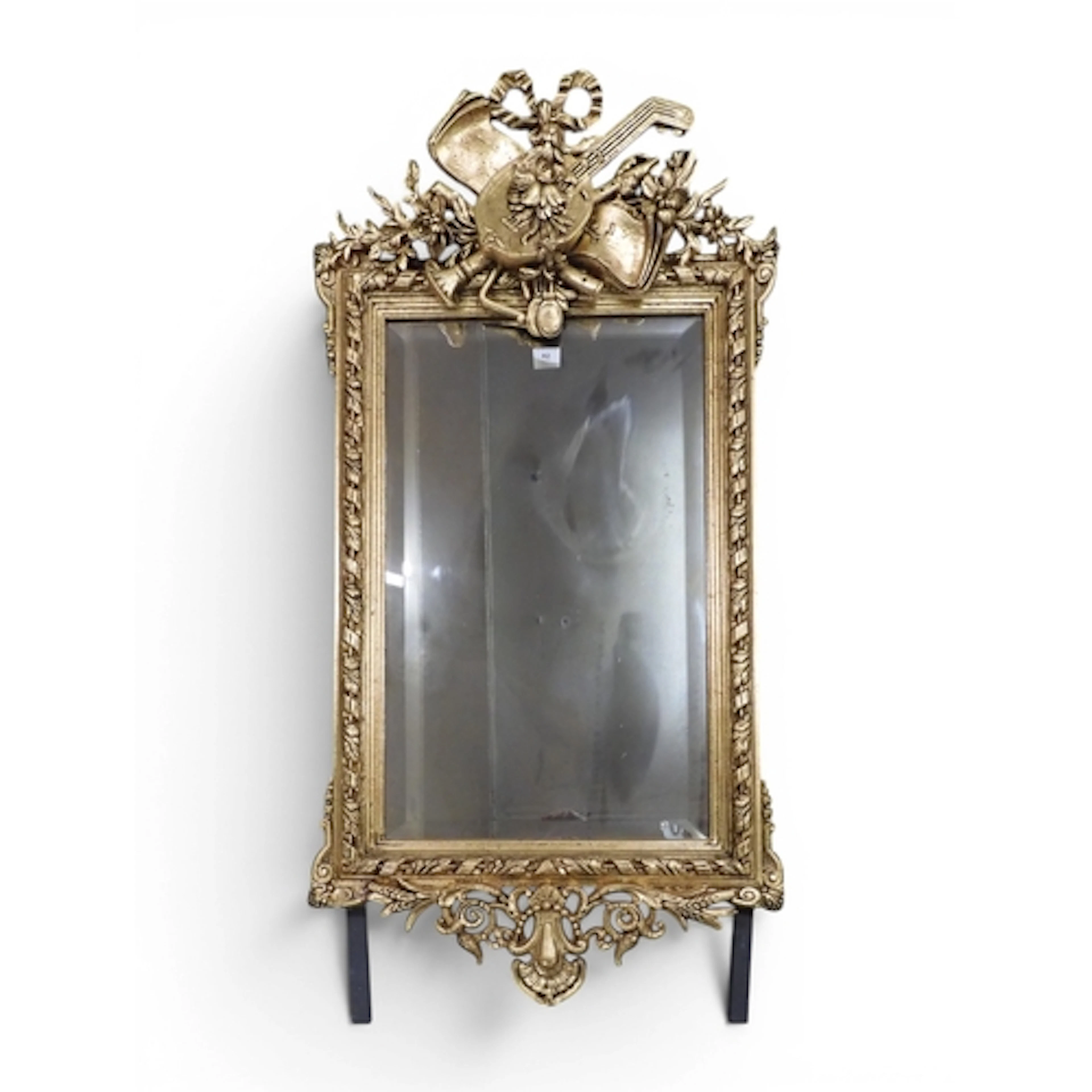 A 19th century gilt gesso framed wall mirror with elaborate ...