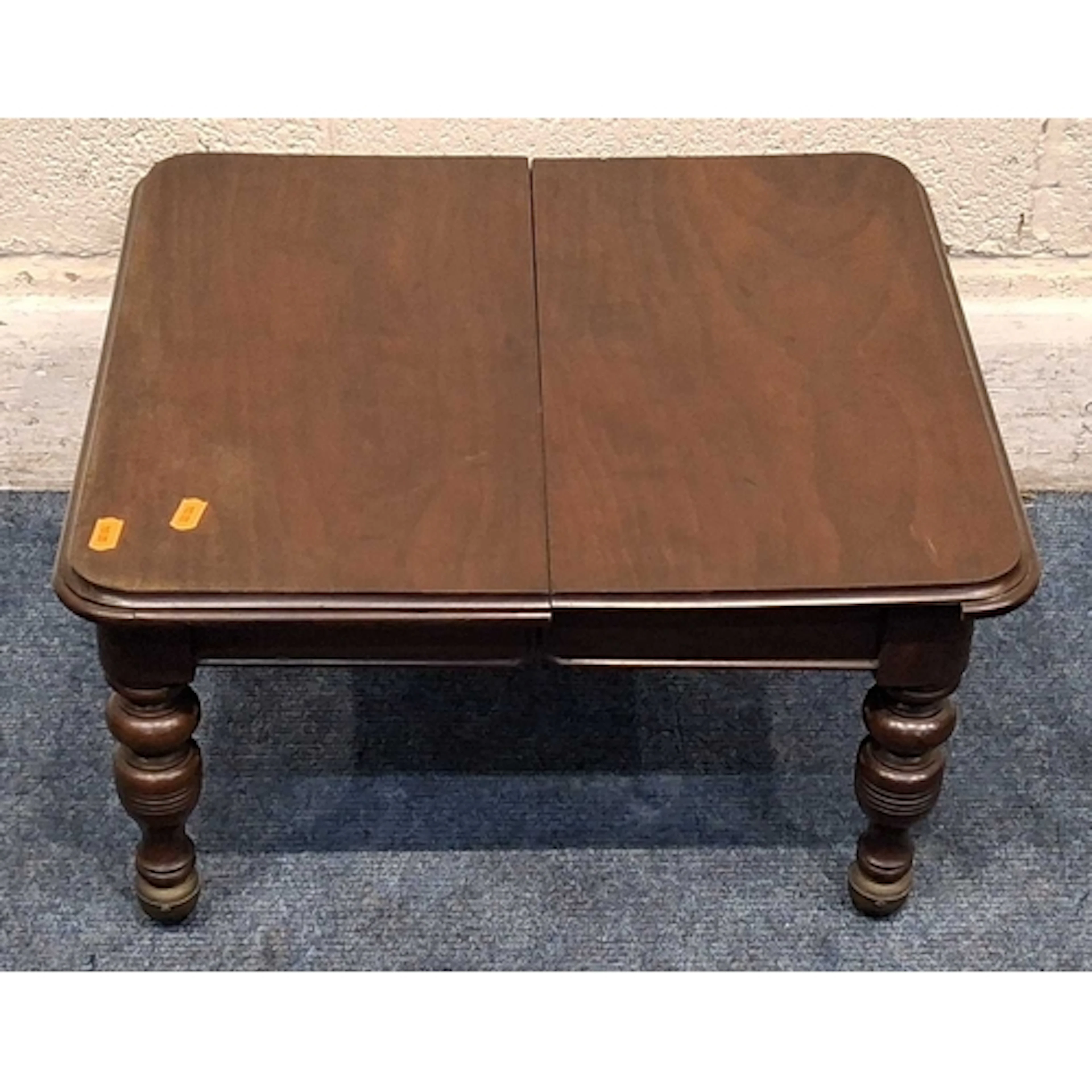 AN APPRENTICE PIECE MAHOGANY WIND OUT DINING TABLE, raised o...