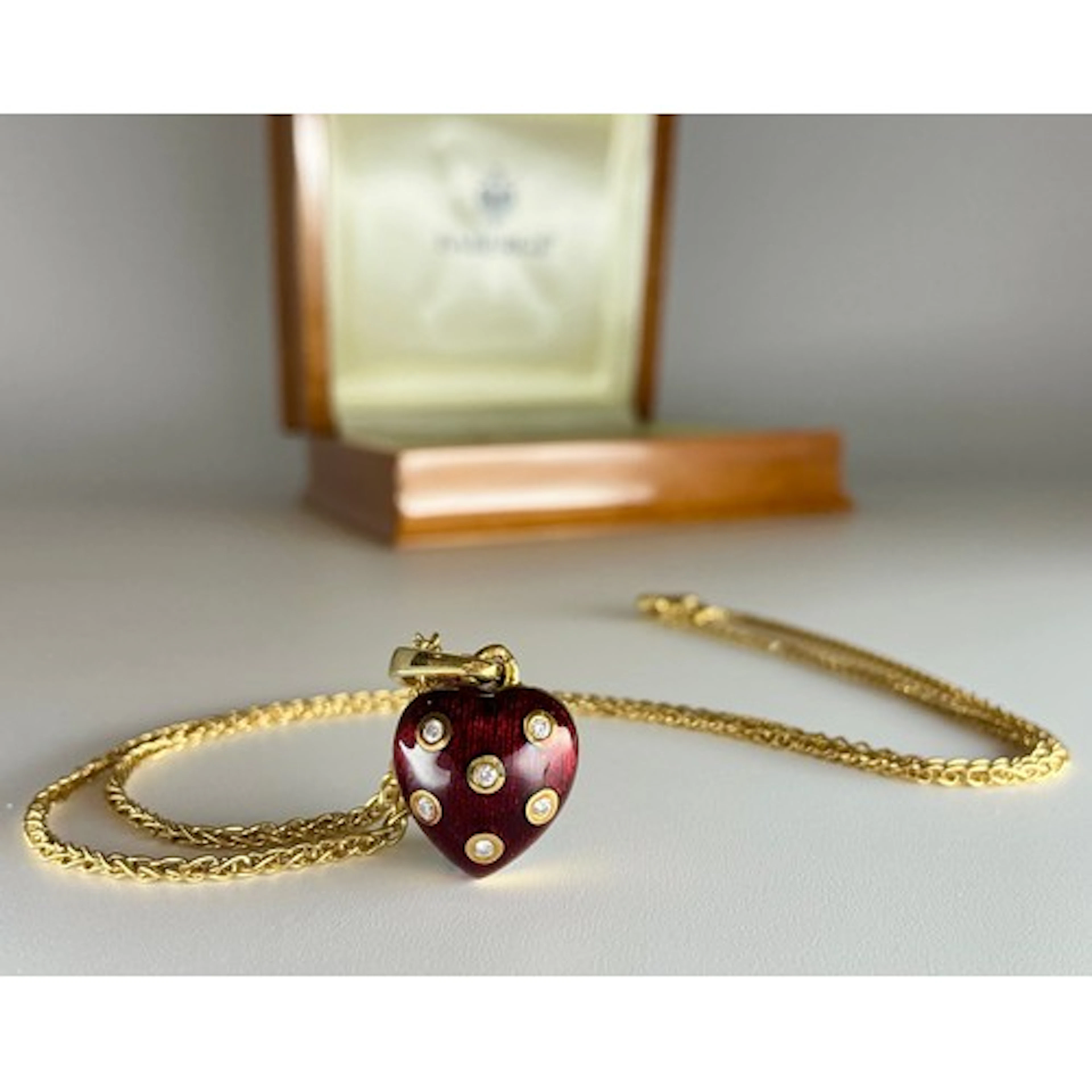 A Fabergé Victor Mayer 18ct gold red enamelled heart shaped ...