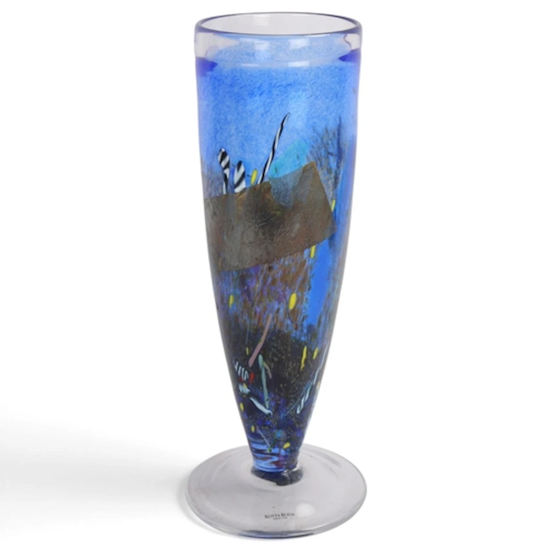 A Kosta Boda "Satellite" vase on a footed clear glass base, ...