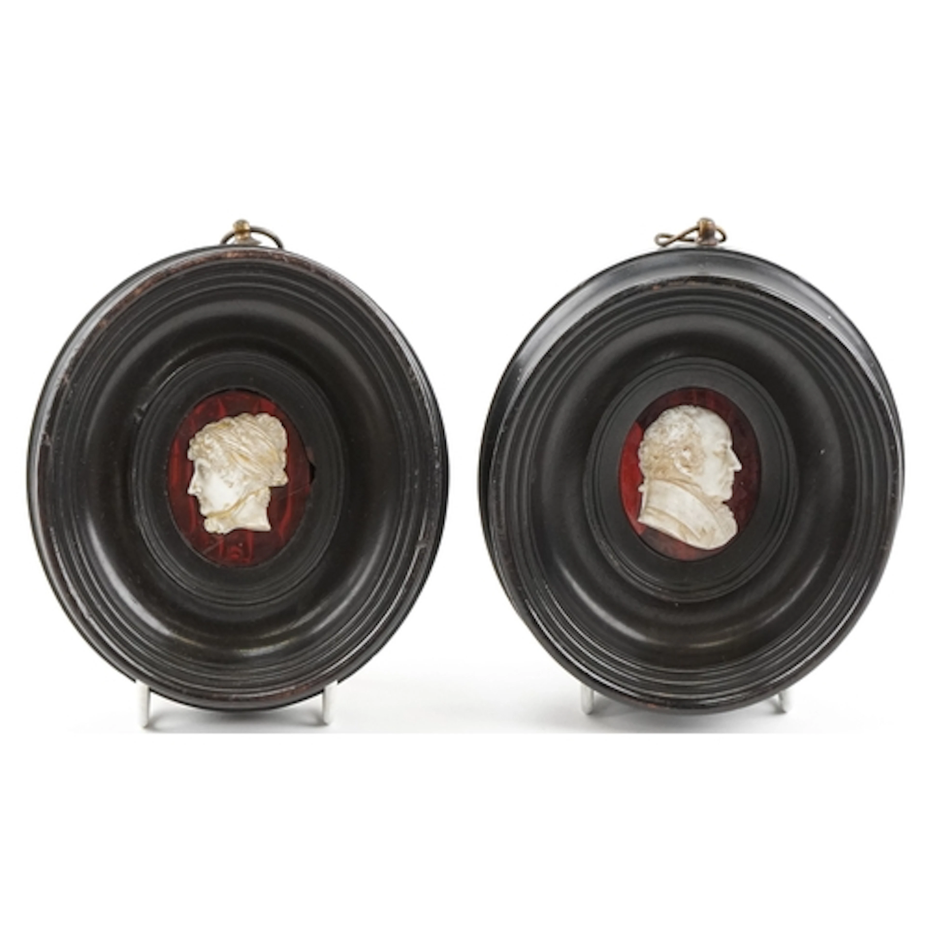 Pair of antique oval cameos carved with a male and a female ...