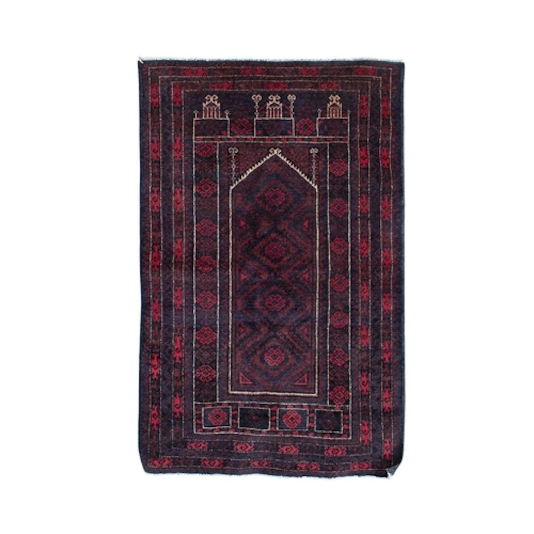 A handknotted Afghan Baluch prayer rug. Wool warp and wool w...