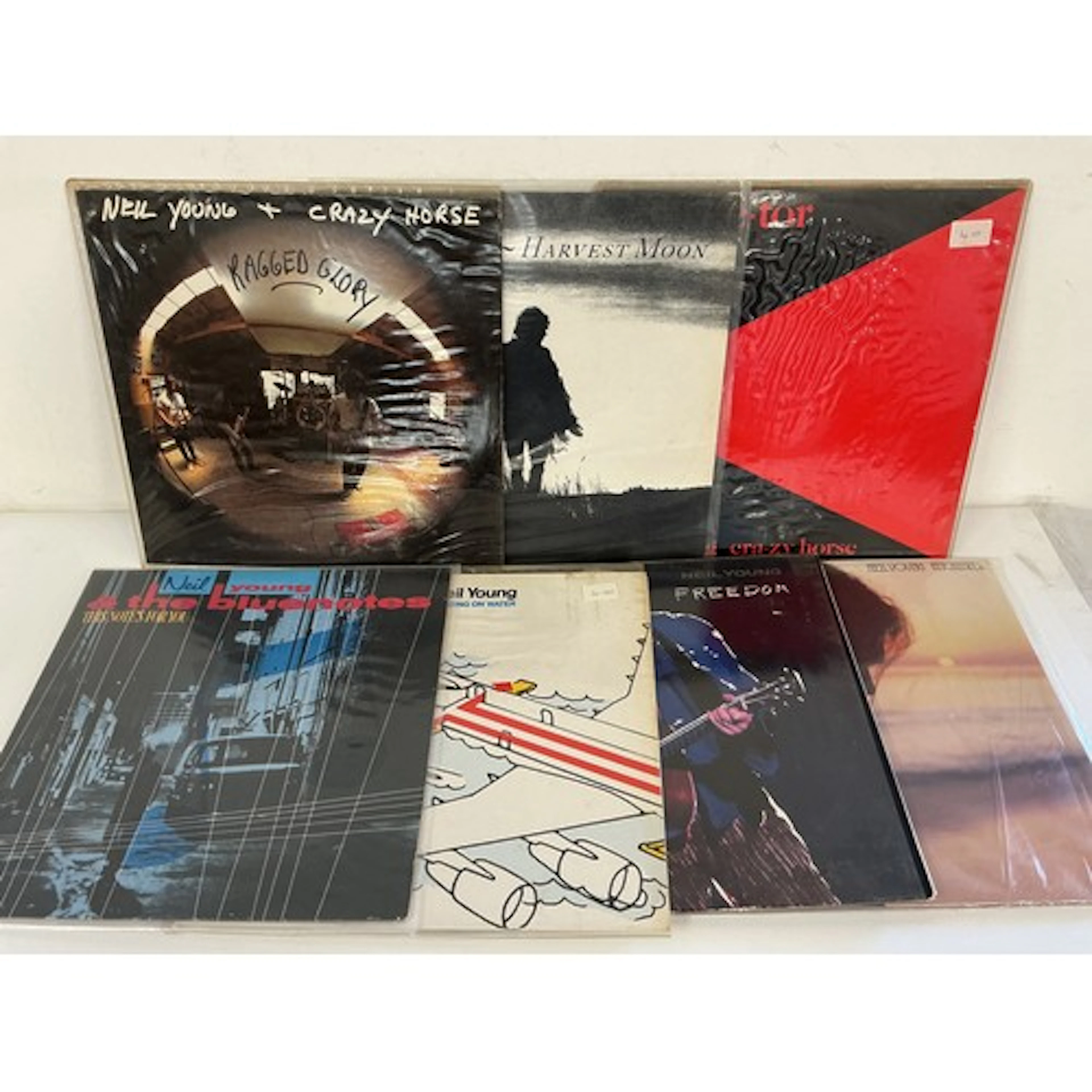 Two bags containing fourteen Neil Young LPs comprising Harve...