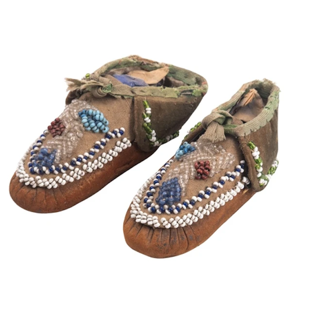 A pair of Native American Indian children's moccasins with g...
