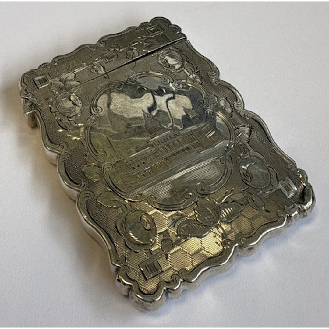 A Victorian silver castle top card case with engraved scene ...