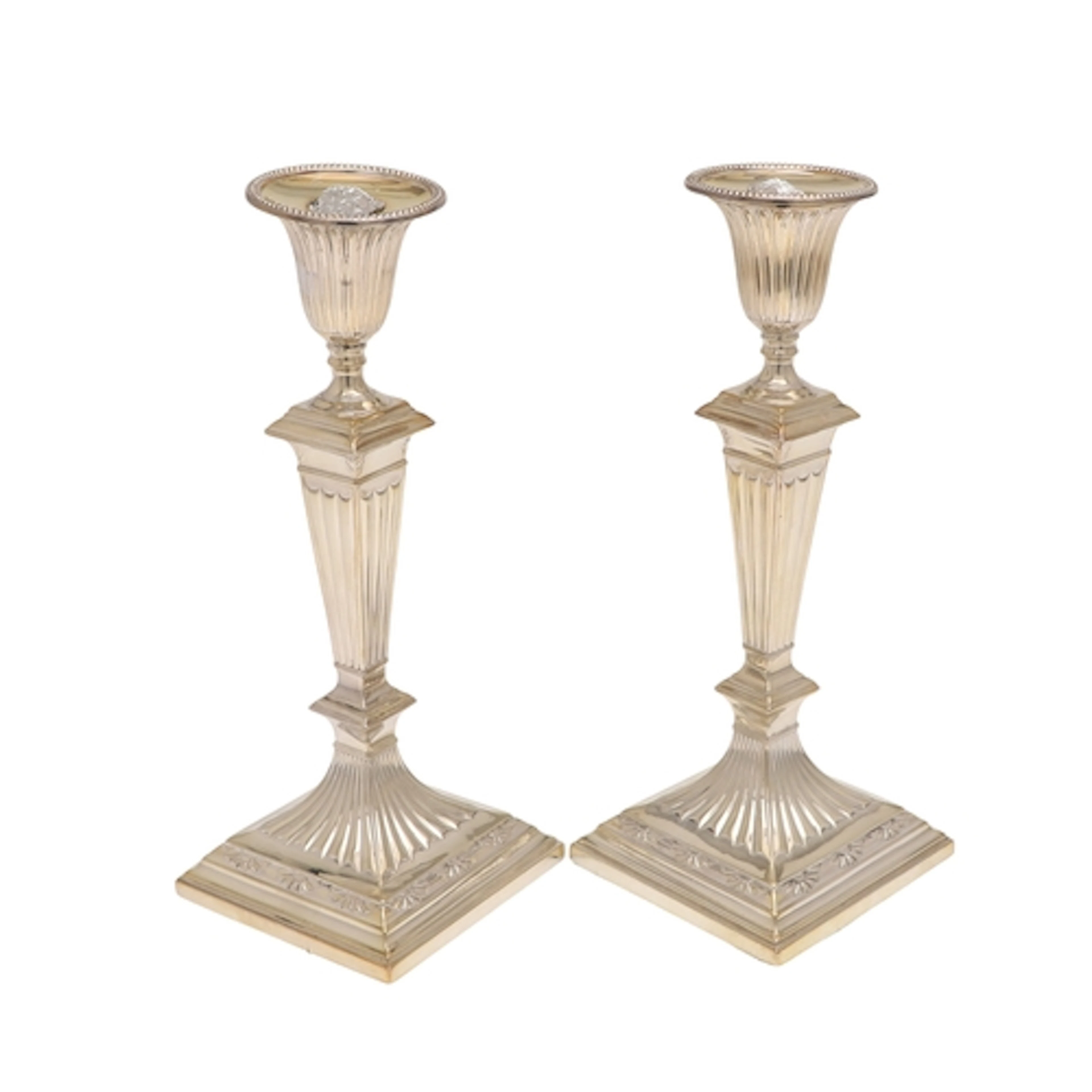 A PAIR OF LOADED VICTORIAN SILVER CANDLESTICKS. The tapering...