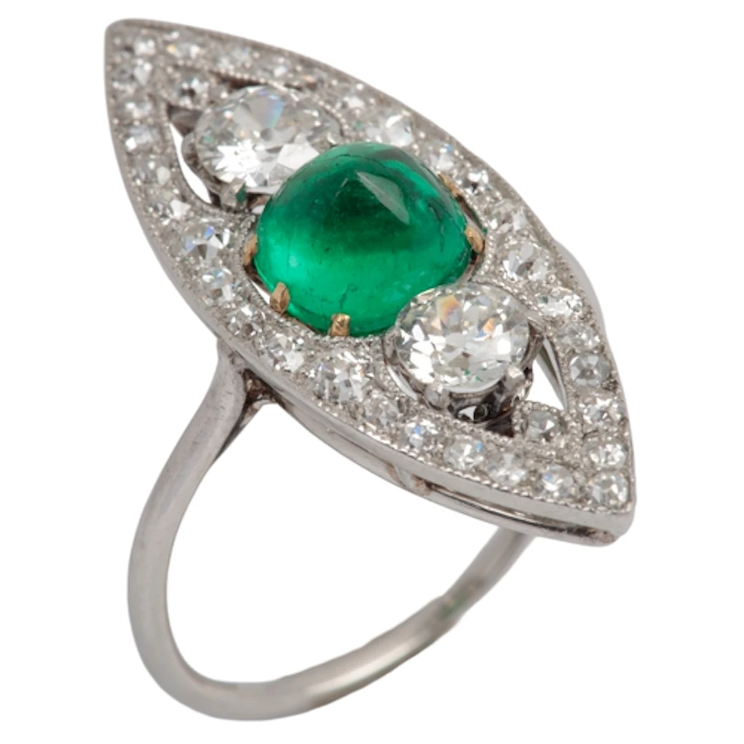 An attractive Art Deco emerald and diamond ring, circa 1920,...