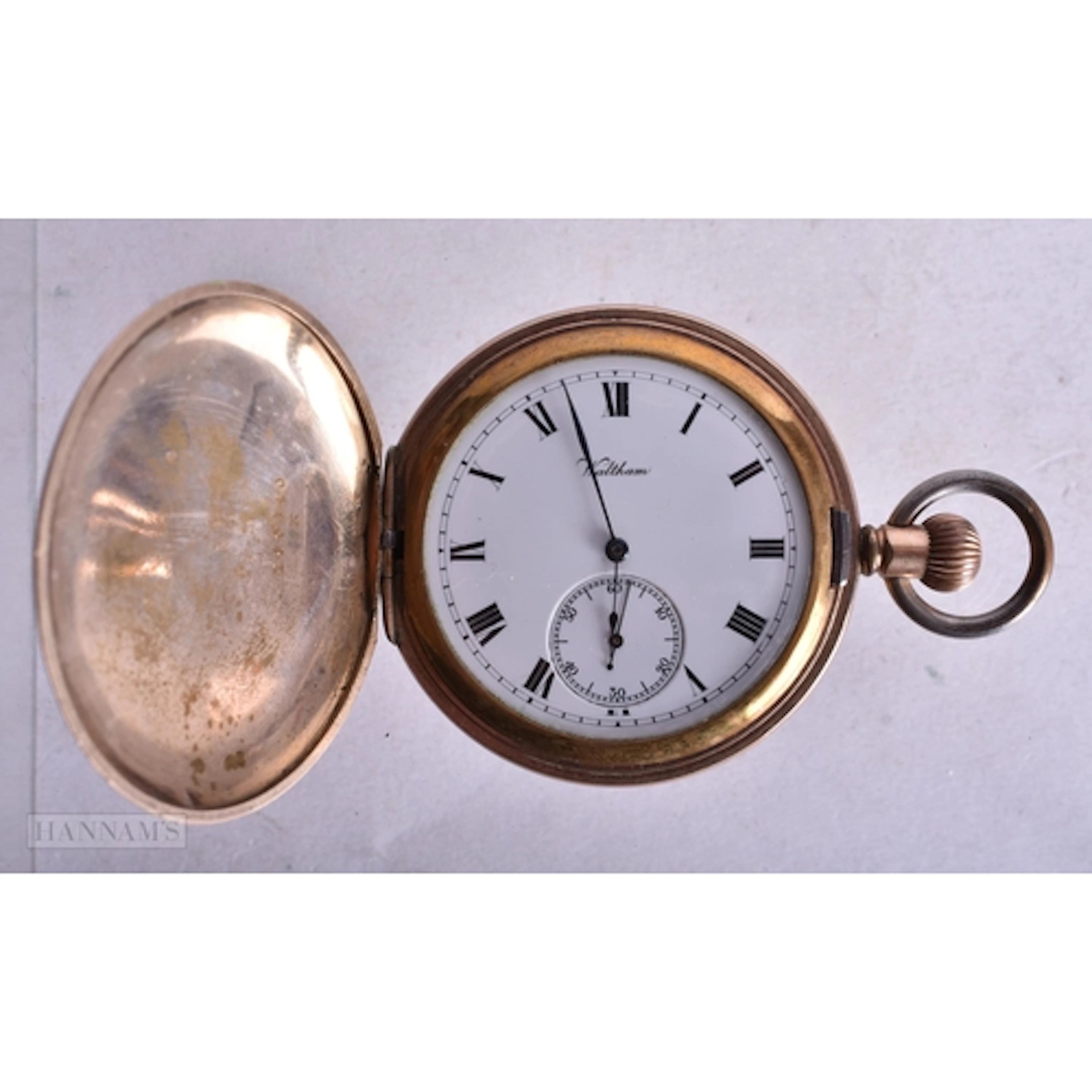 A Waltham Hunter Pocket Watch with Gold Tone Case. 5cm diam...