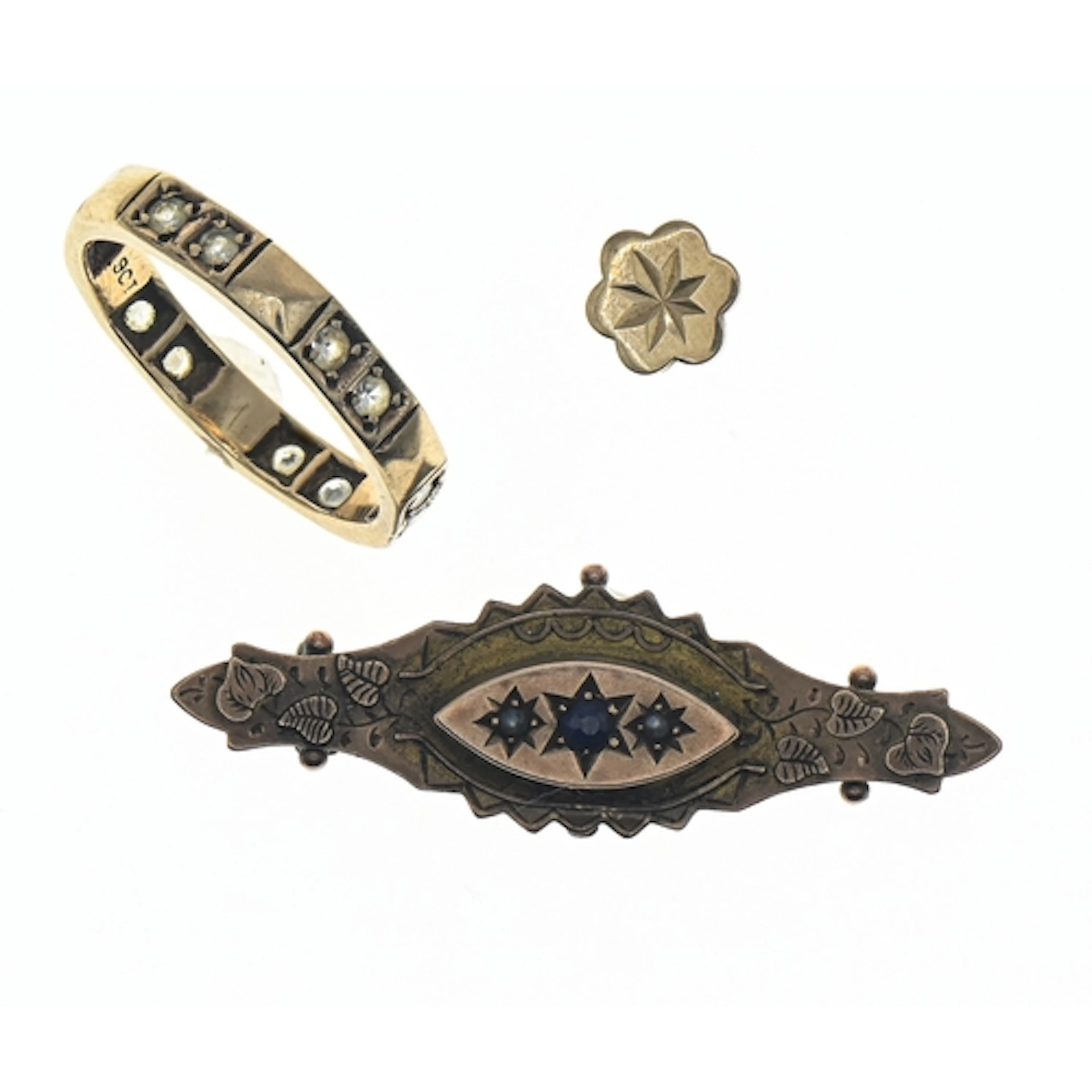 Three pieces of yellow metal jewellery, comprising: a white ...