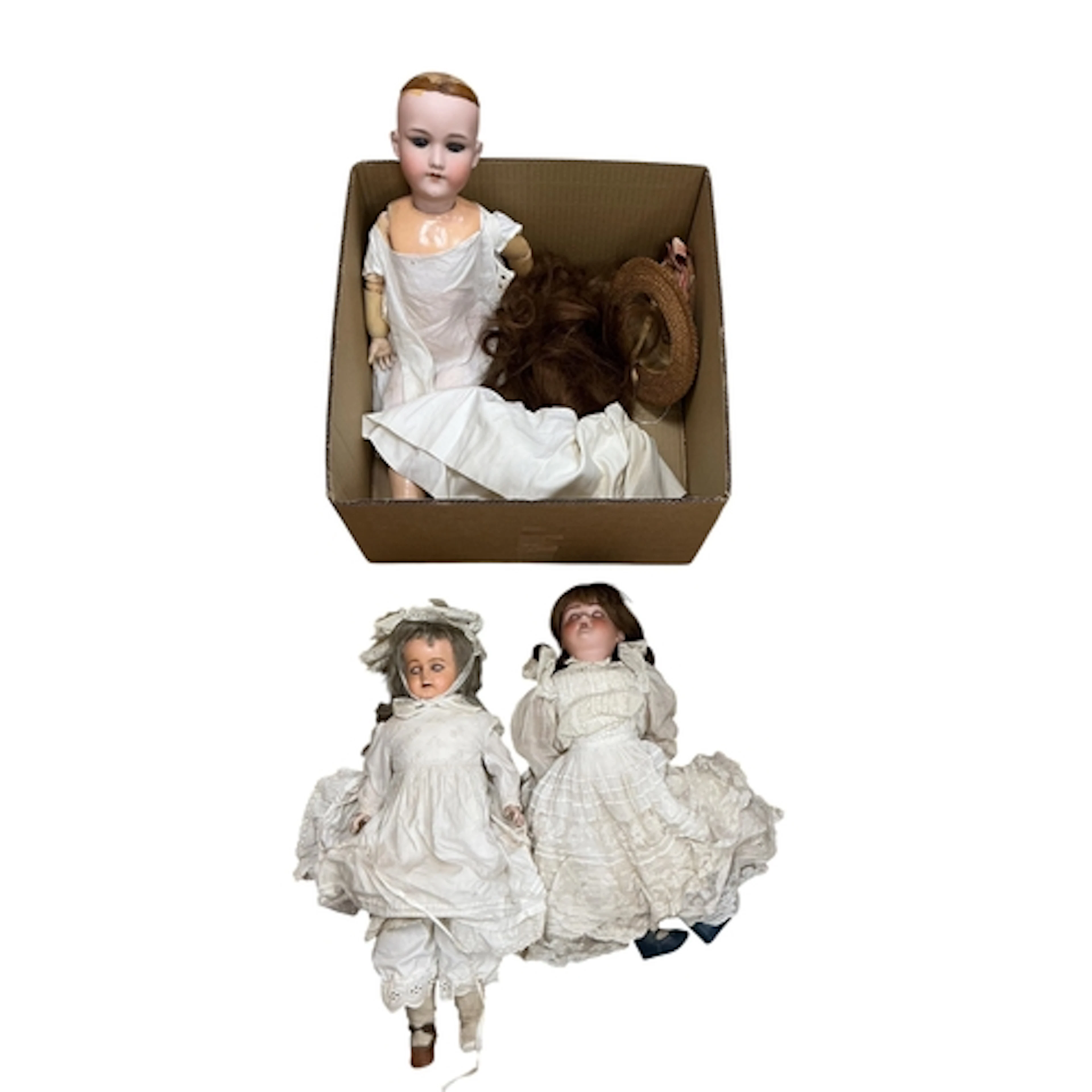 Two bisque dolls and a composition doll; an Armand Marseille...