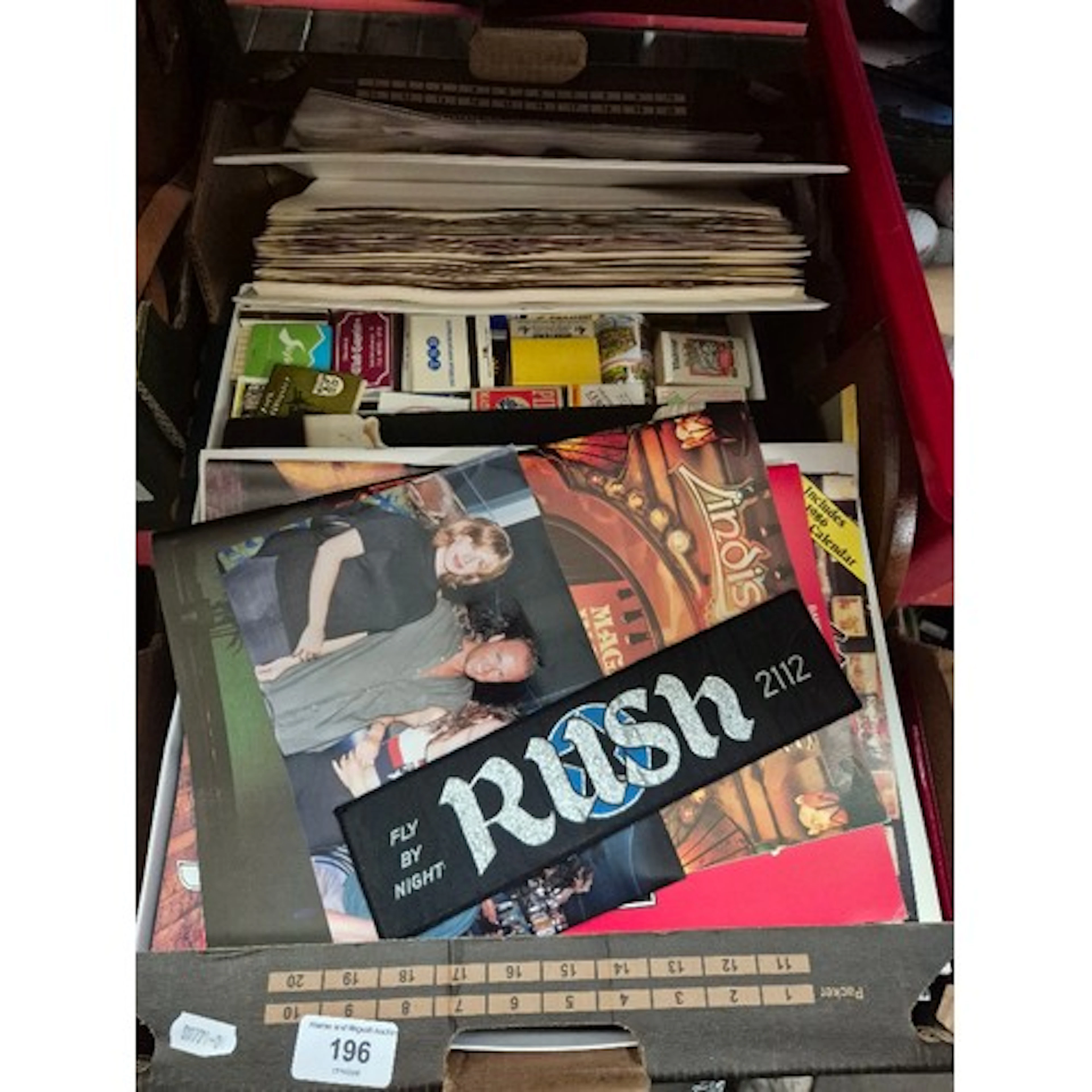 A box of assorted collectables to include music tour program...