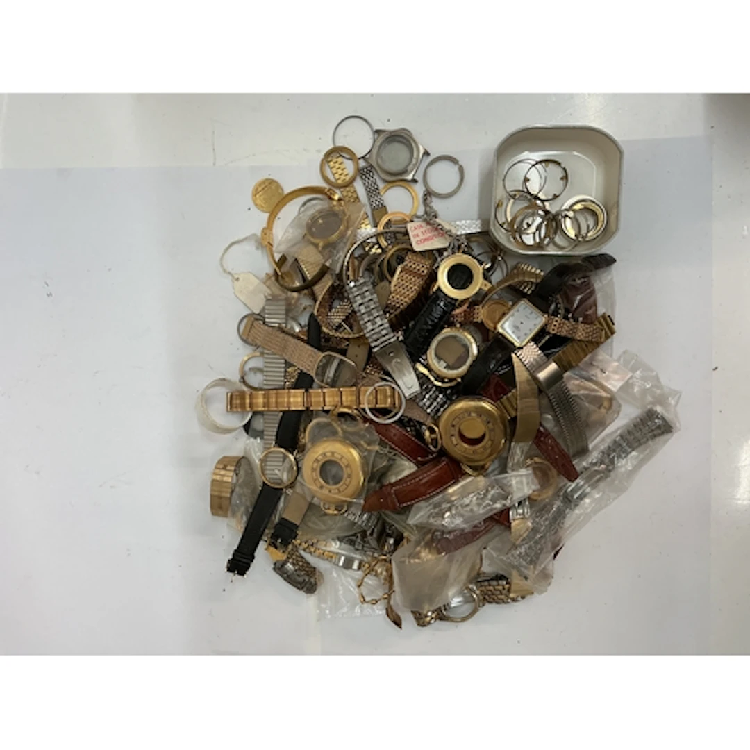 A quantity of assorted watch straps and parts including gold...