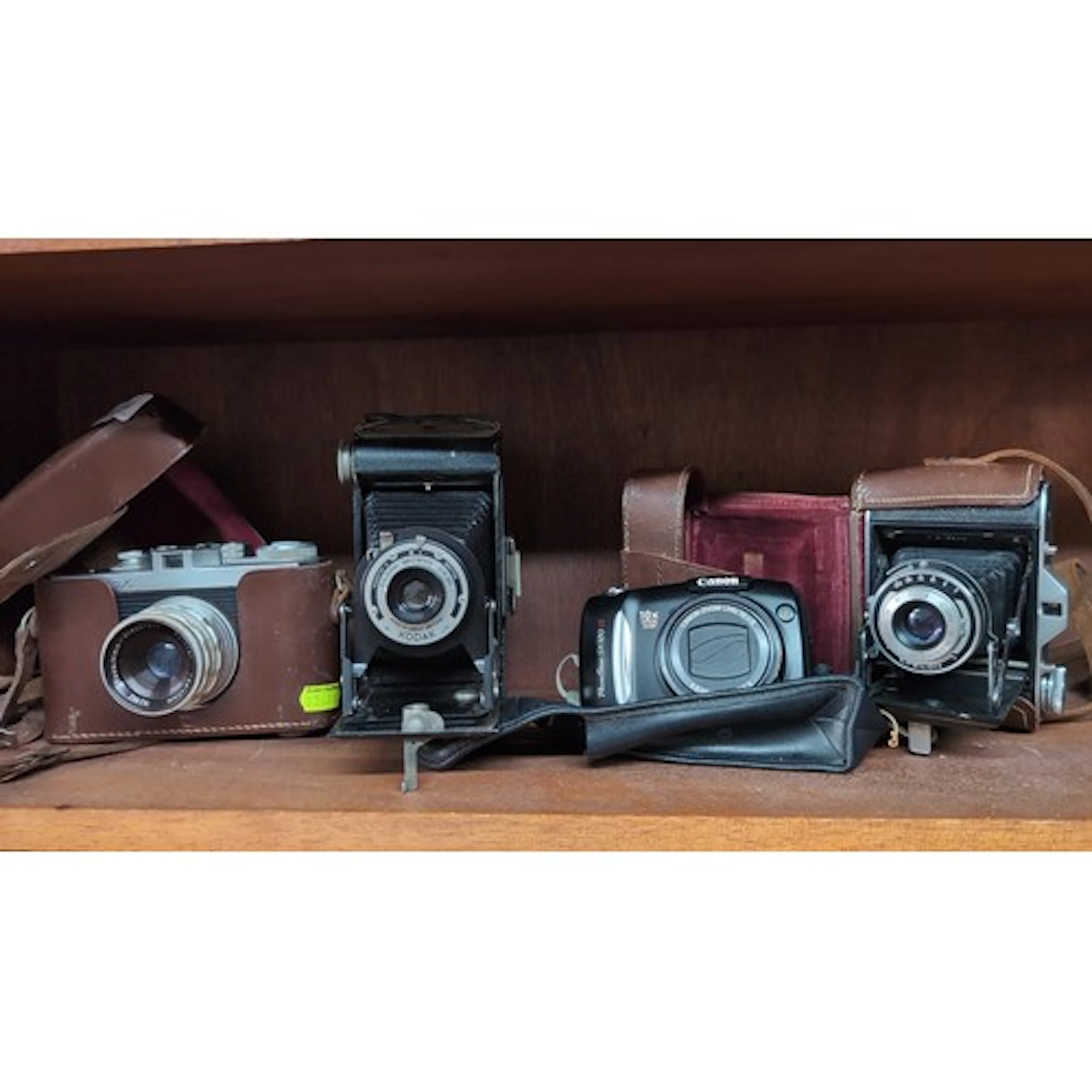 A group of cameras including a Kodak Folding Brownie Six-20,...