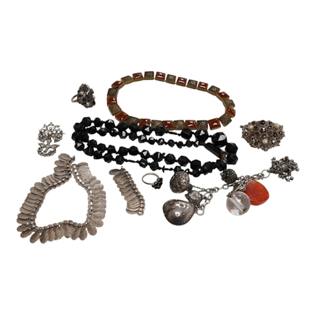 A collection of jewels including a facetted jet bead necklac...