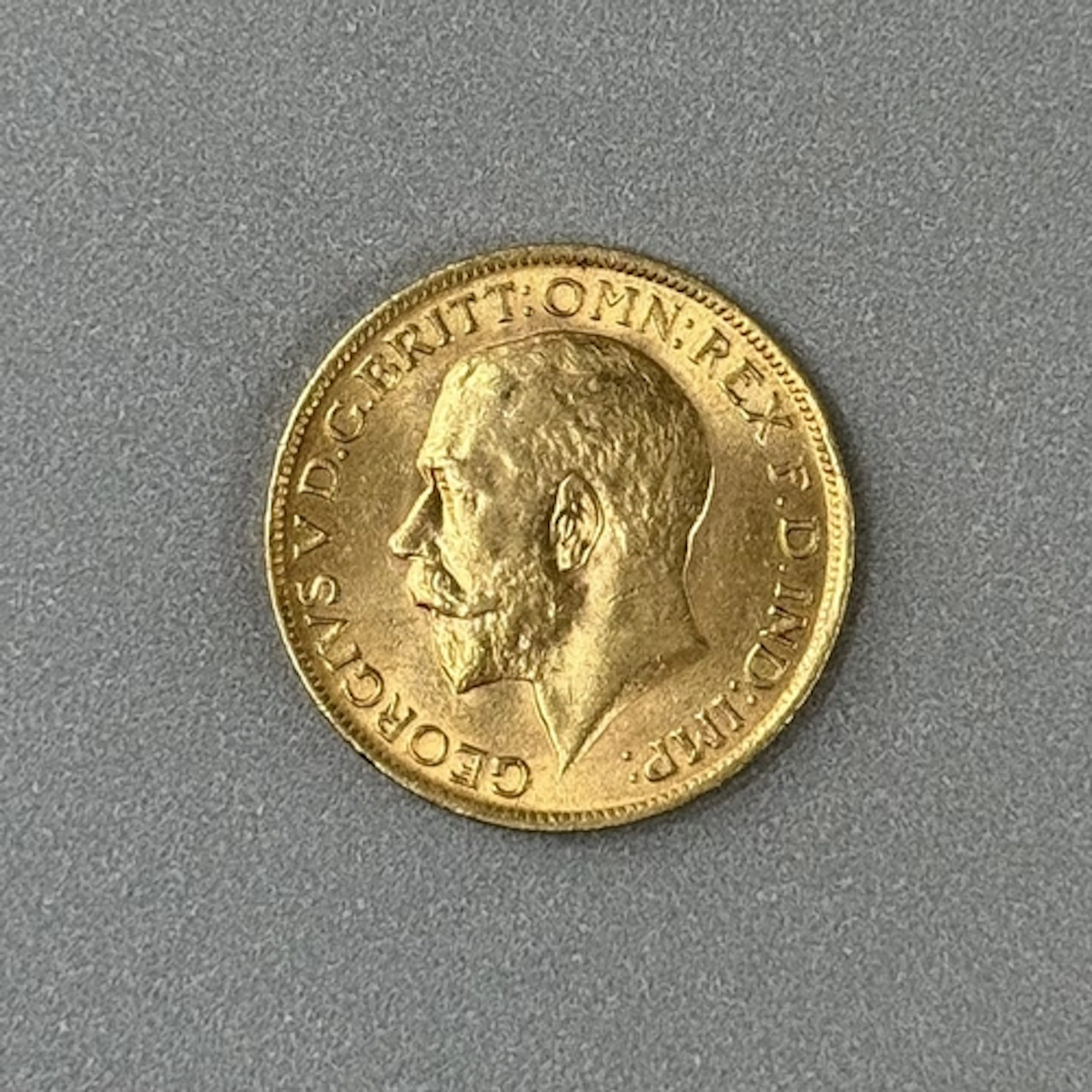 Coins: a 1912 George V full gold sovereign, circulated....