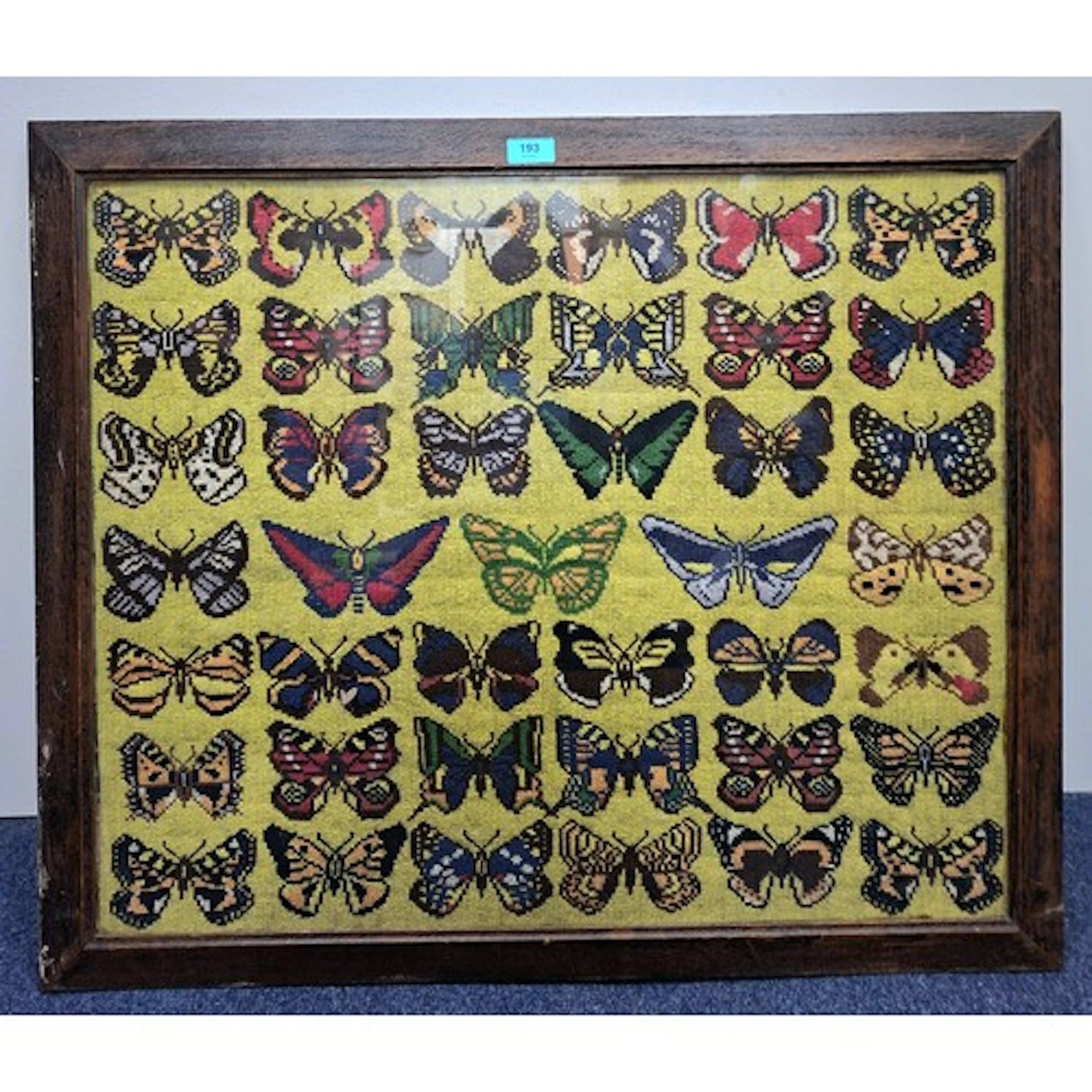A vintage oak framed wool-work depicting 41 butterflies, app...