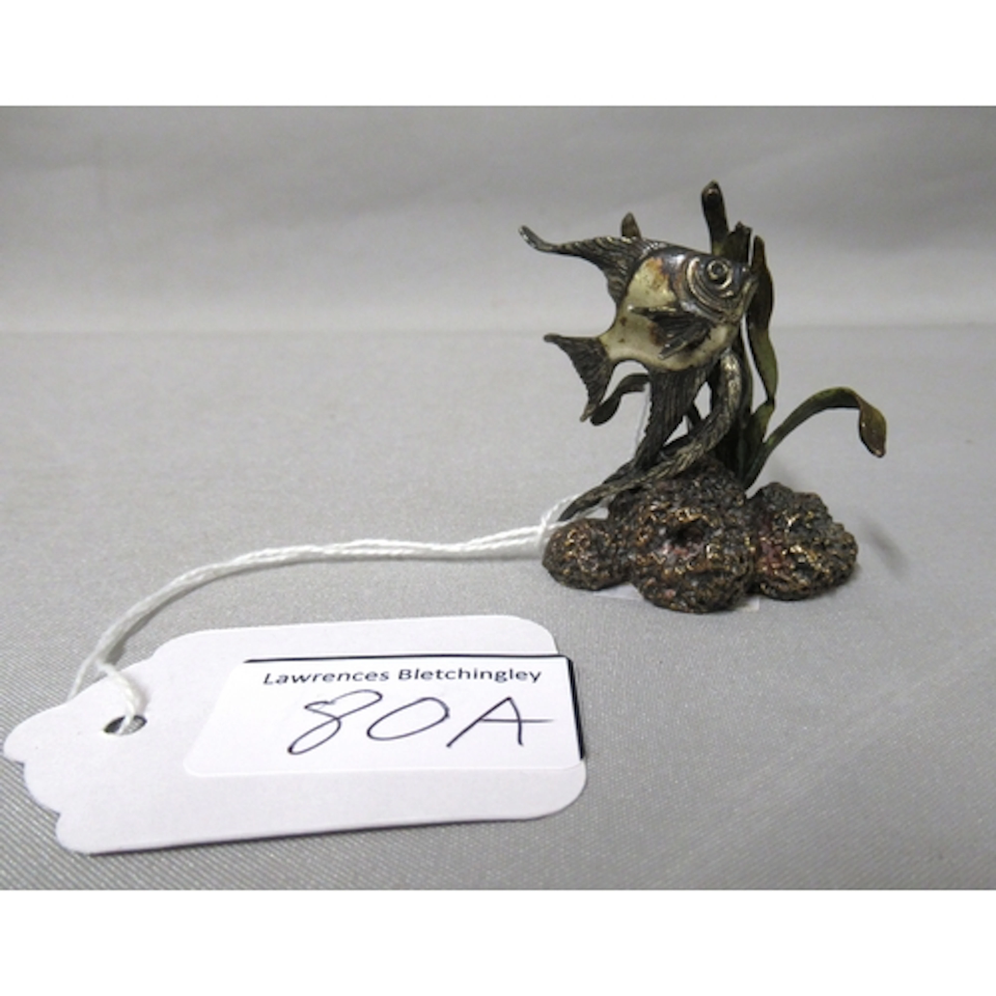 Miniature cold painted sculpture of an angel fish in sea gra...