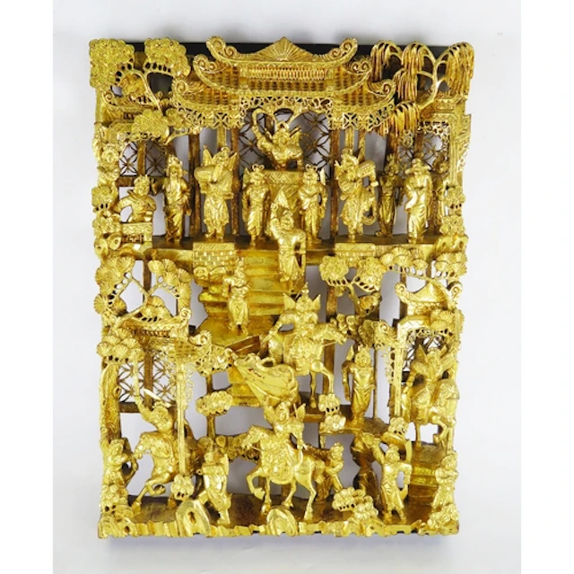 A Chinese carved giltwood panel depicting mounted warriors a...