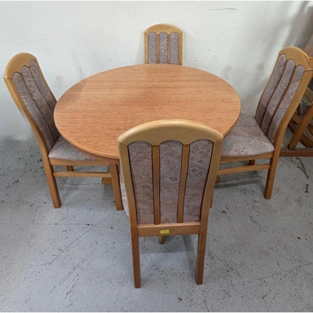 A Mid Century round dining table and chairs by Aztec