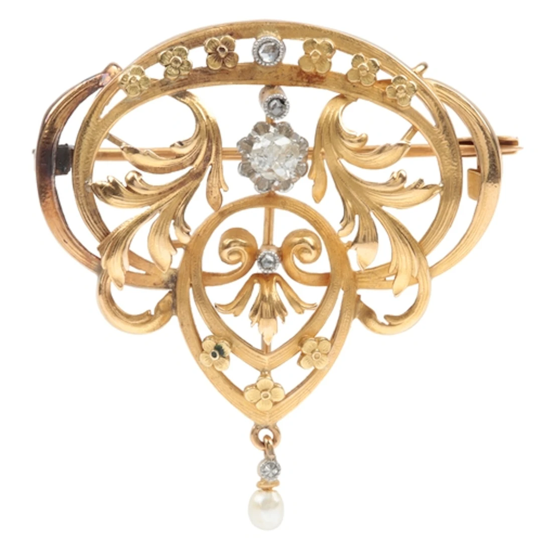 A gold and diamond brooch, France, circa 1900, of foliate sc...