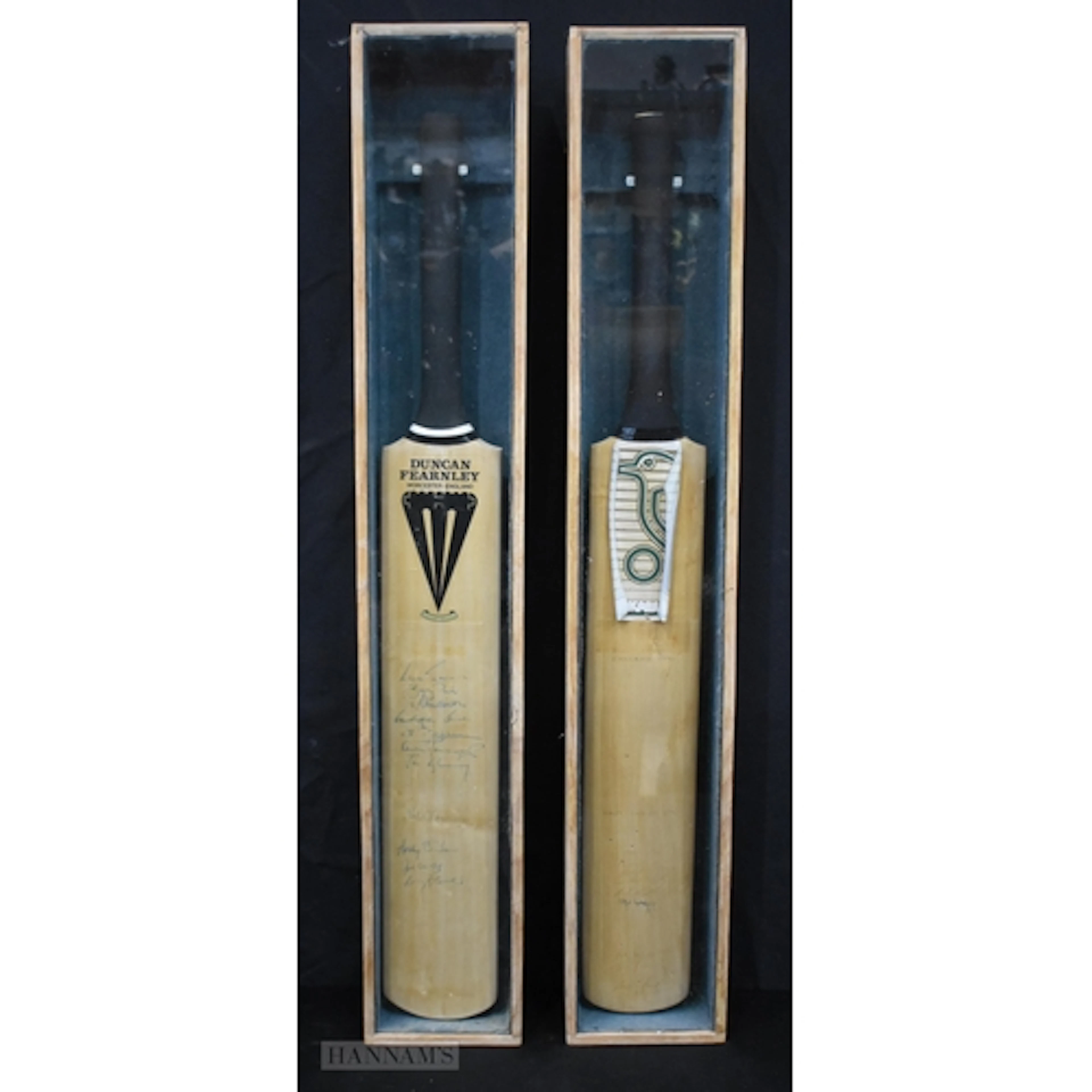 Two cased and Autographed cricket bats one England V West I...